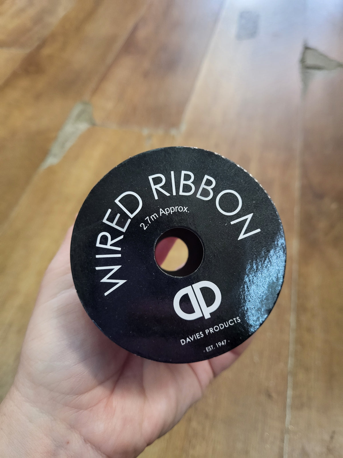 2.7m approx. roll of navy/champagne gold snowflake wired ribbon image 2