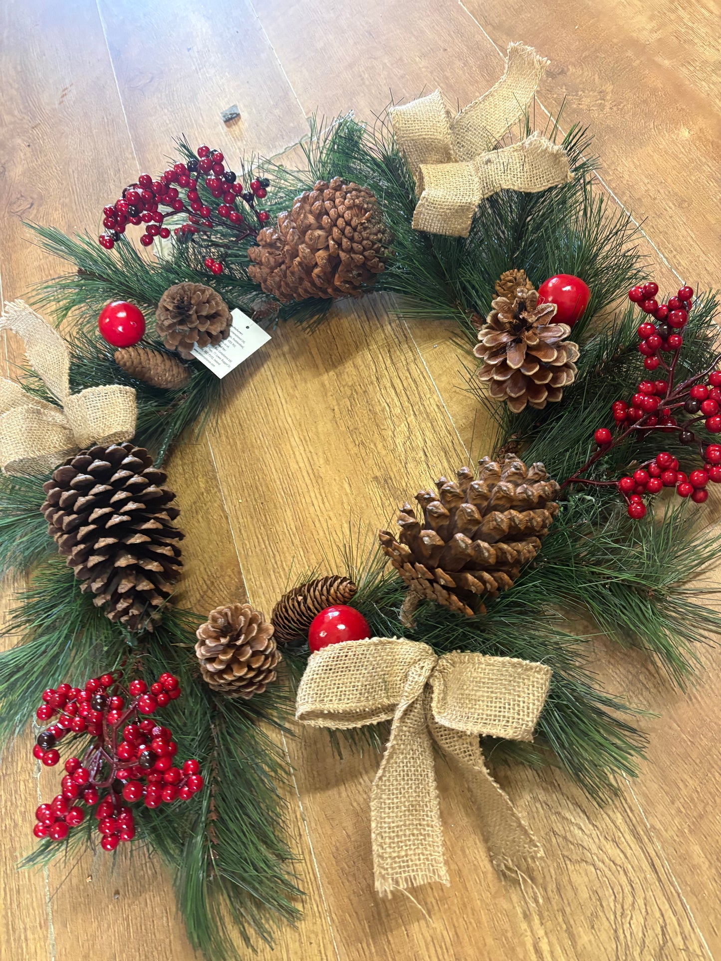 Red berry, cone and bow wreath (55cm from tip to tip)