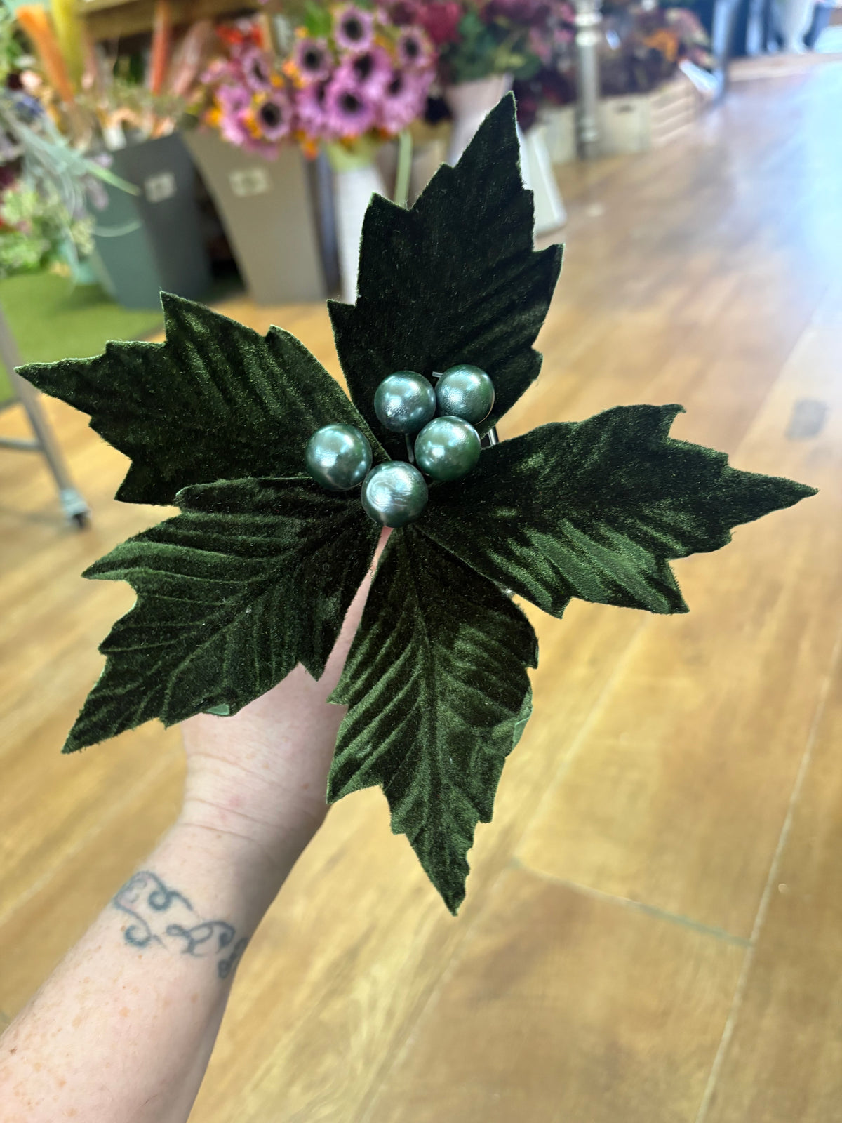 Small green velvet poinsettia pick