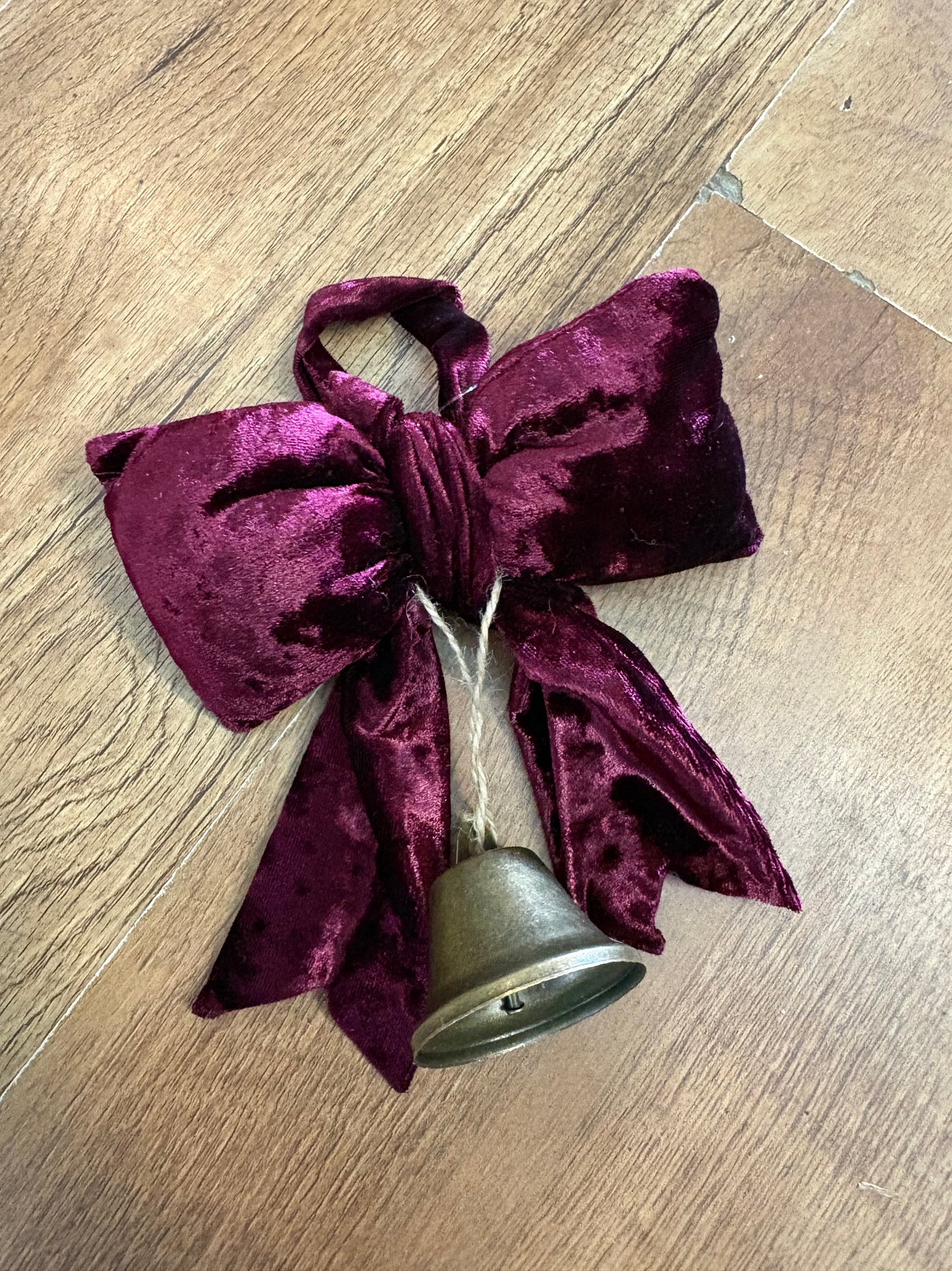 Small hanging burgundy velvet bow and Christmas bell