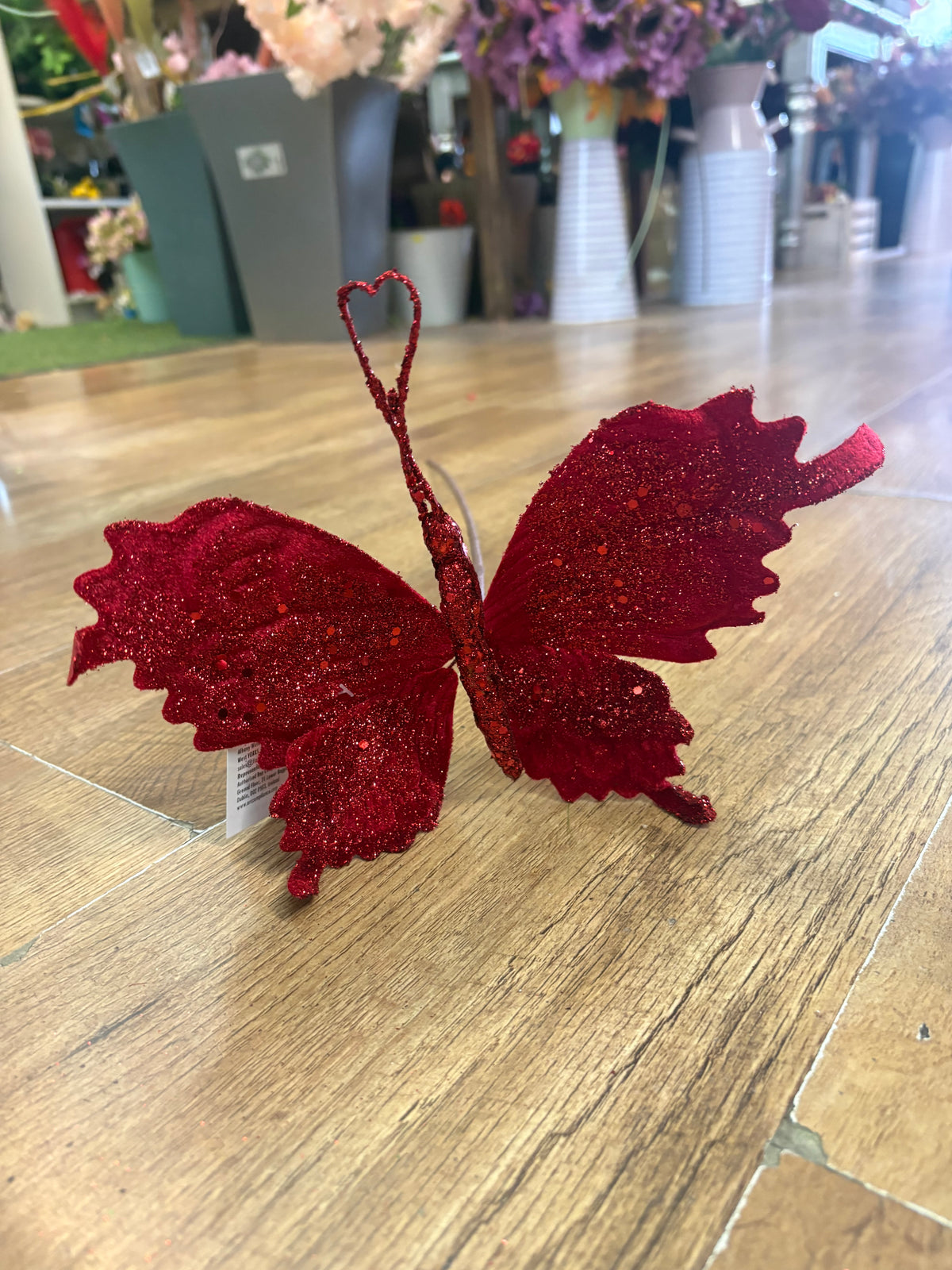 Long stem red velvet and glitter butterfly