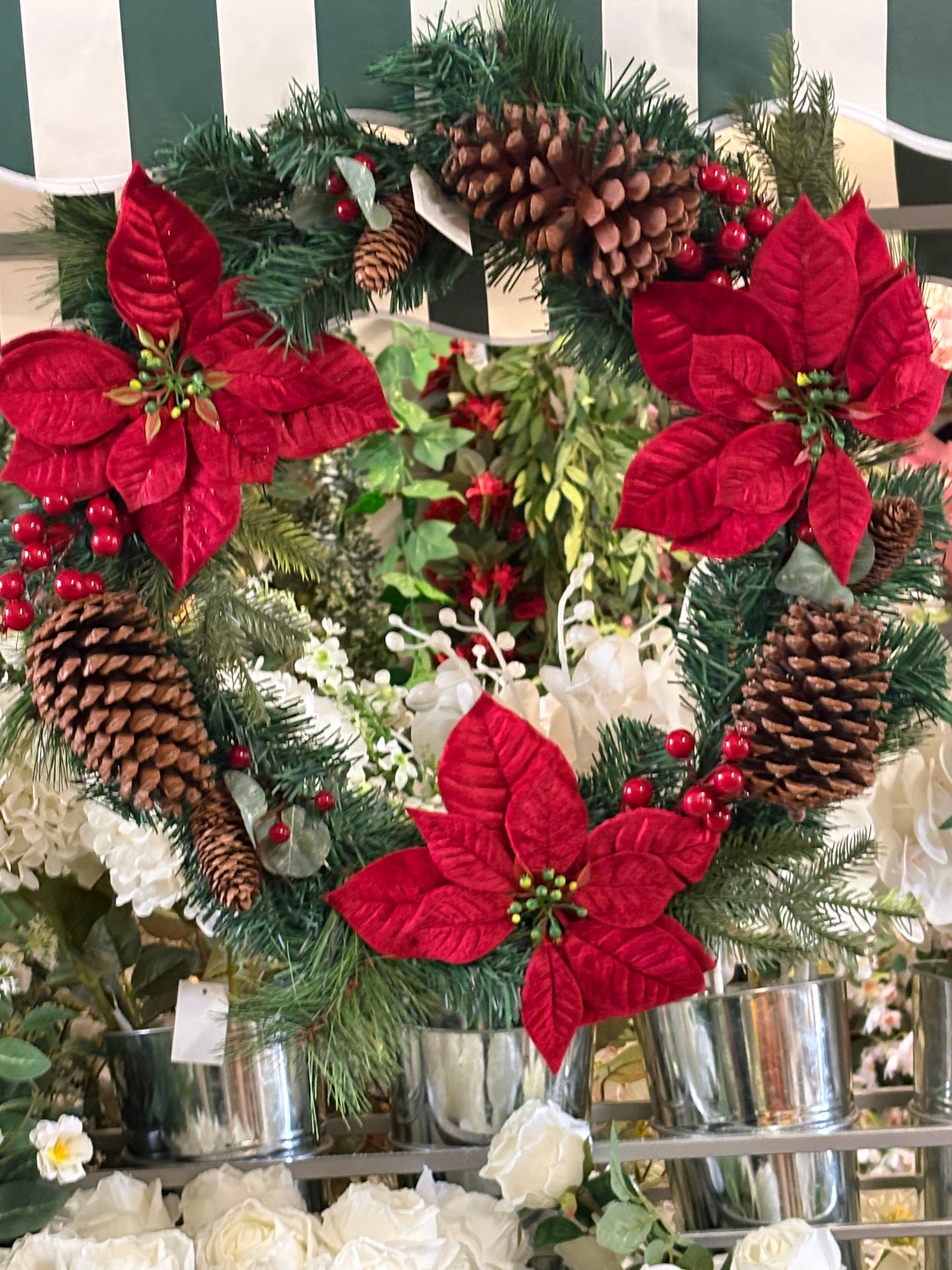 Poinsettia and red berry wreath (55cm from tip to tip)