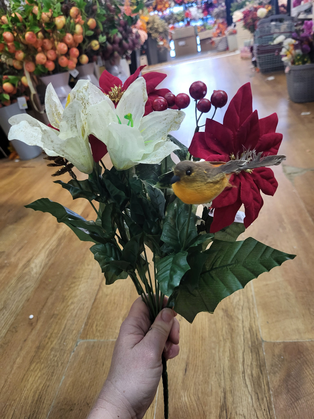 Poinsettia, lily and robin bouquet image 3