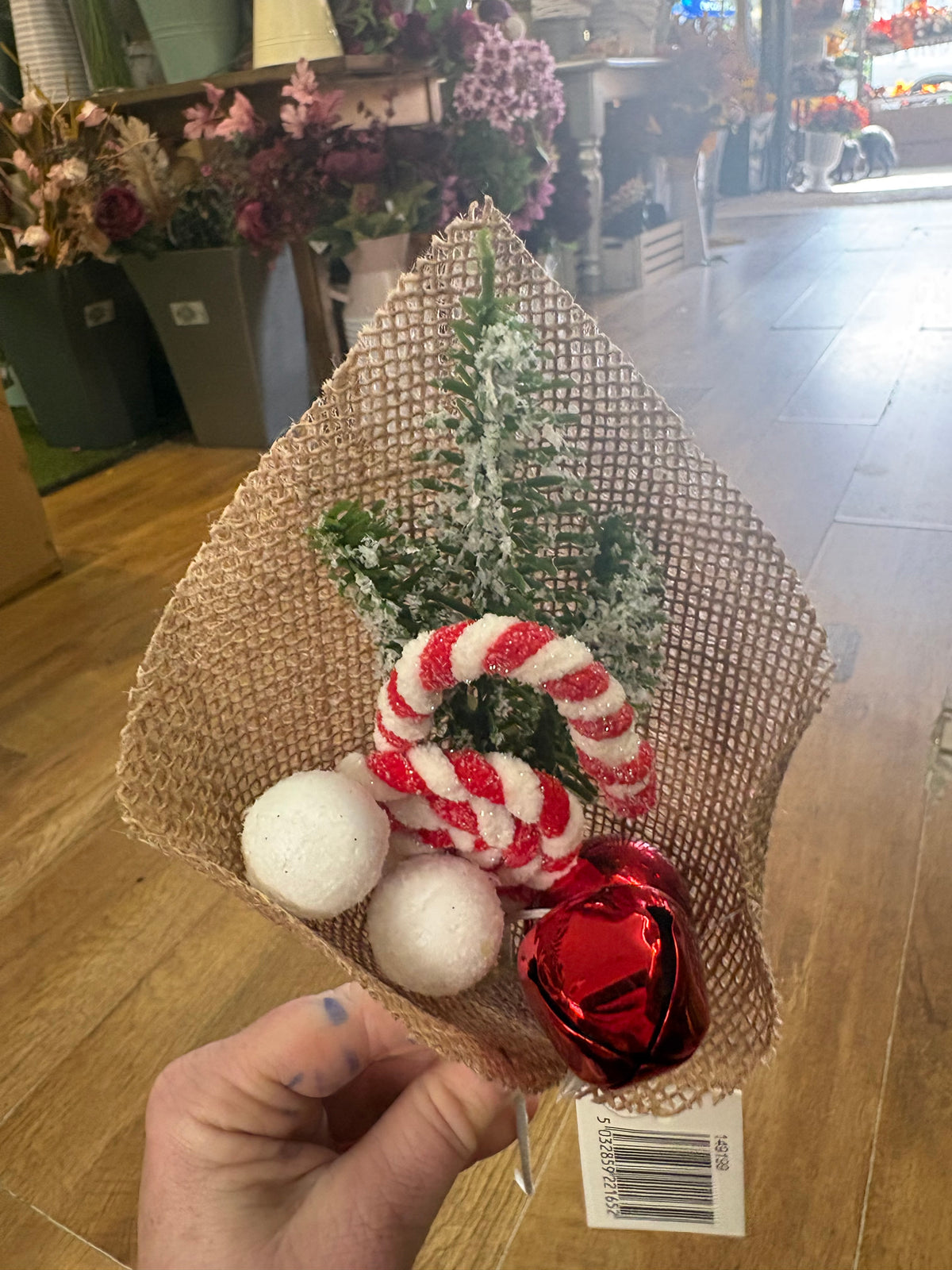 Candy cane and bell pick wrapped in hessian