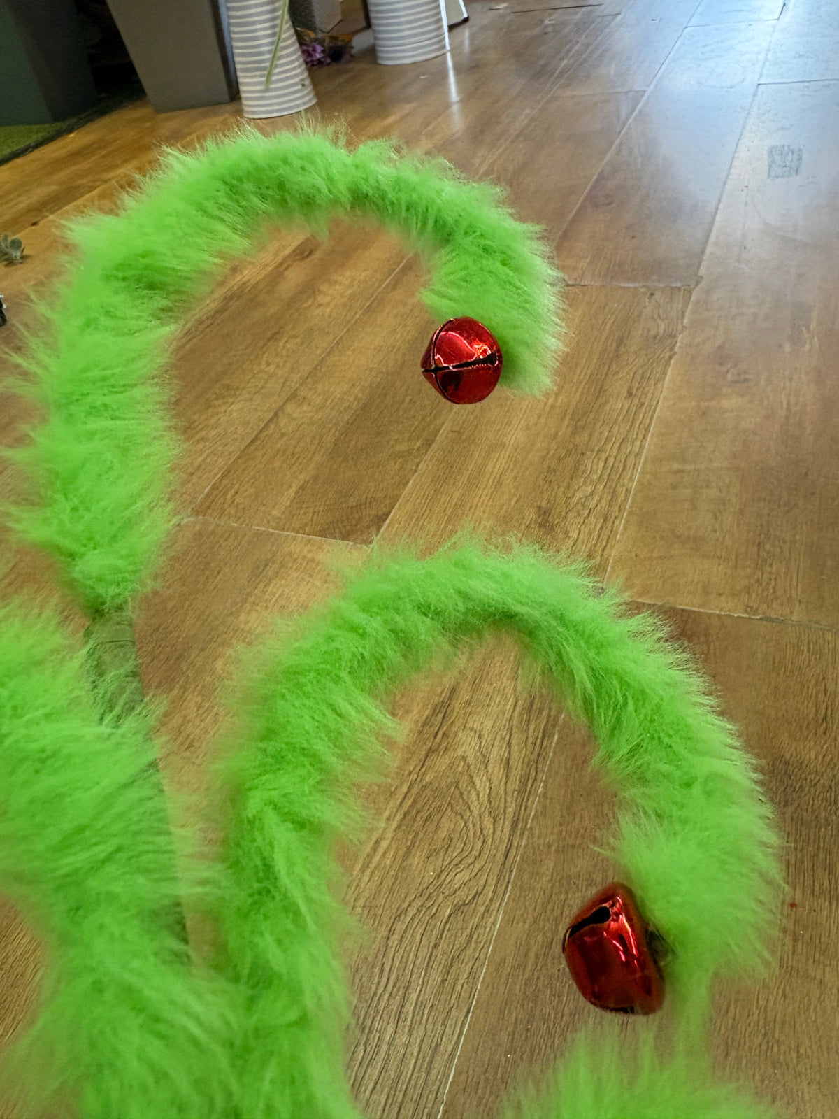 Fluffy green swirly stem with red bells