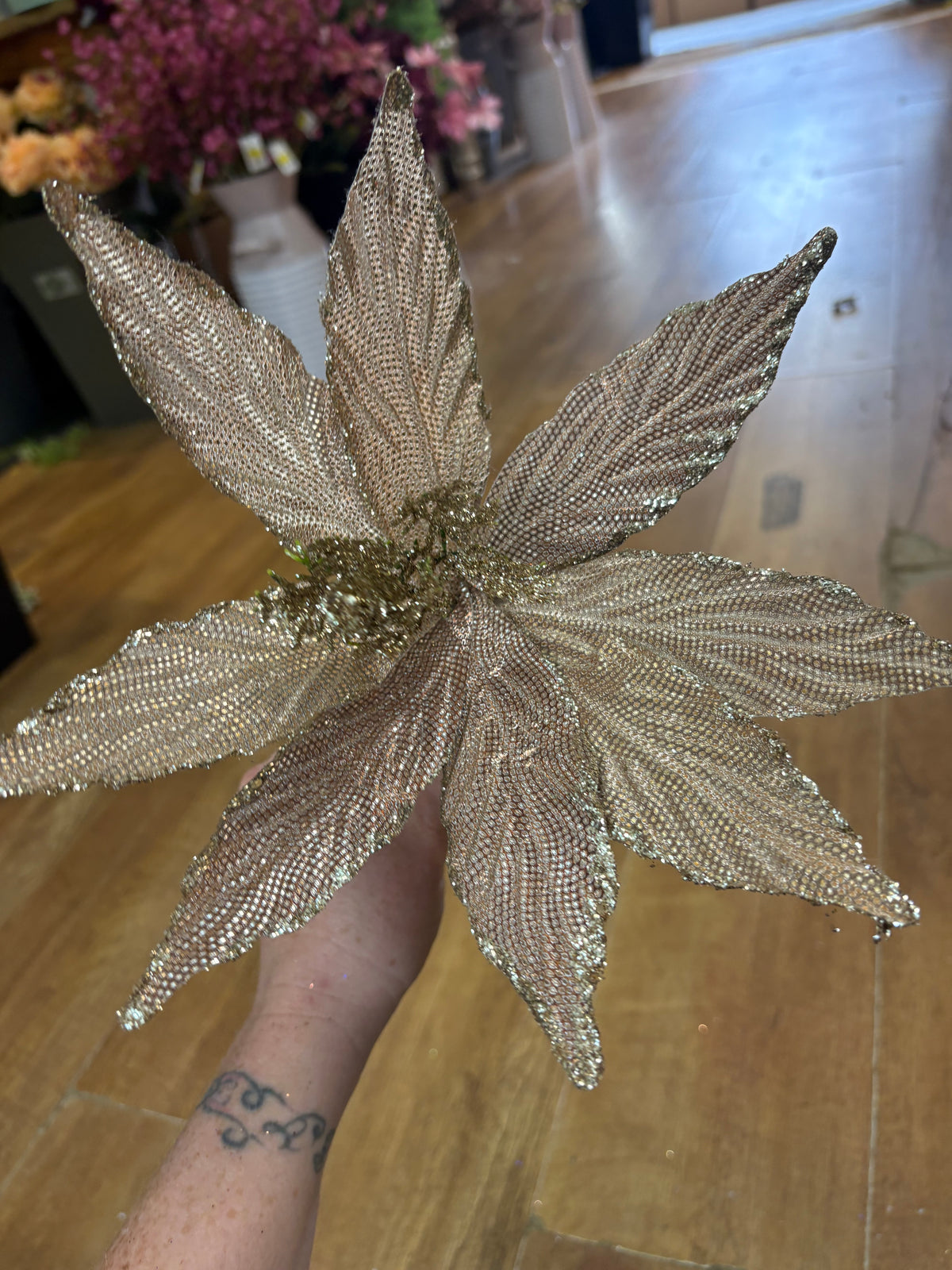 Single champagne glittered poinsettia