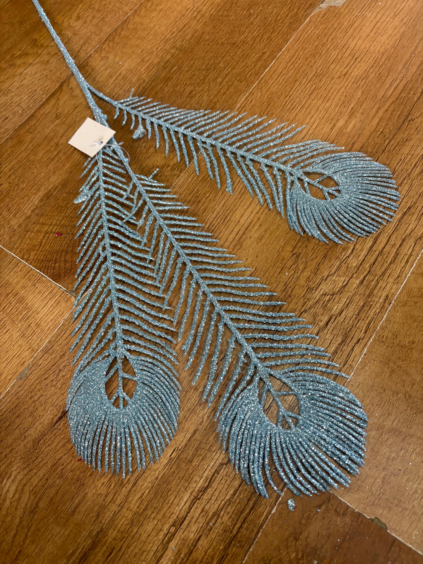 Long stem pale blue glittered peacock feathers