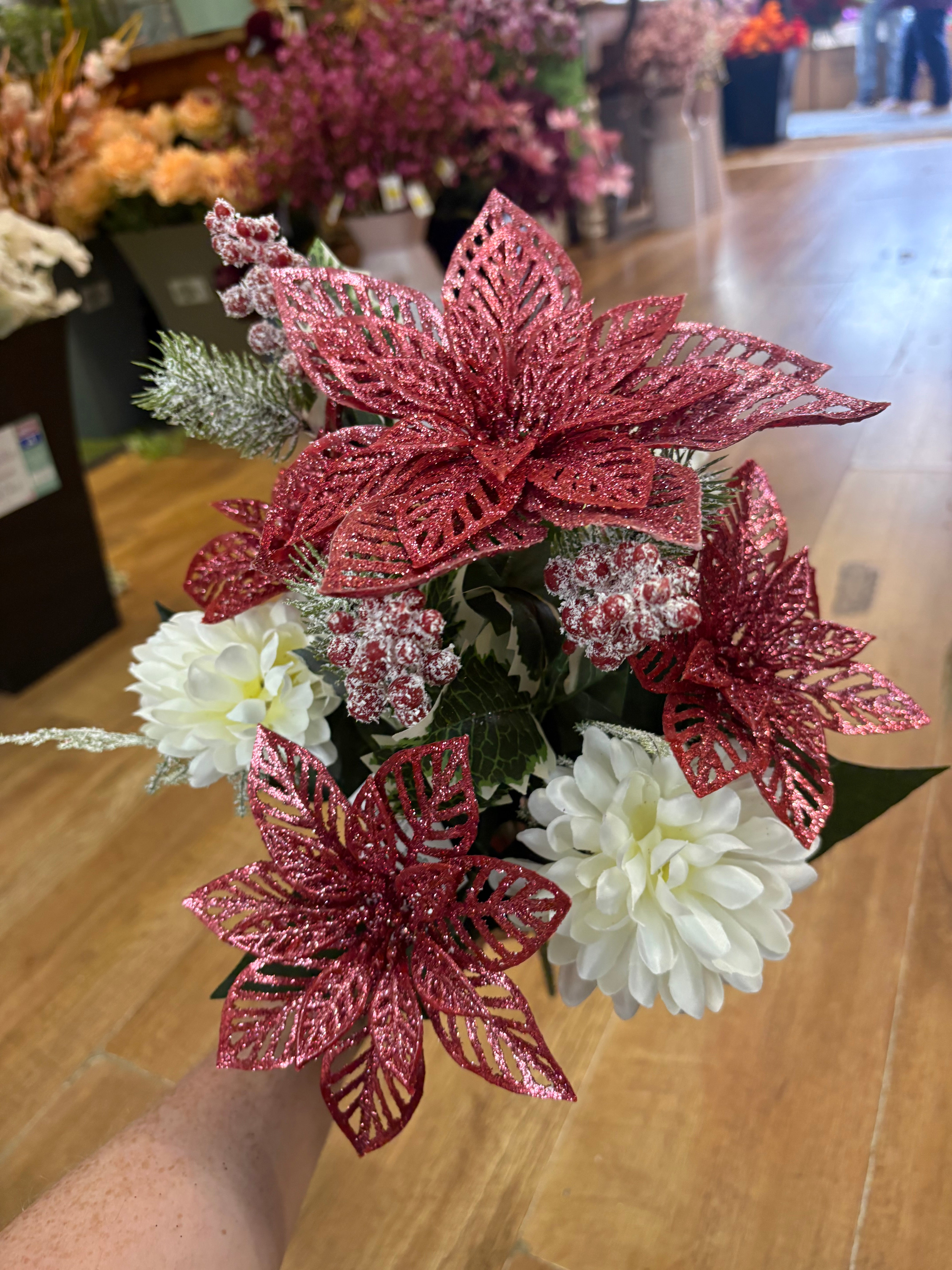 Pink glittered poinsettia and cream chrysanthemum bouquet