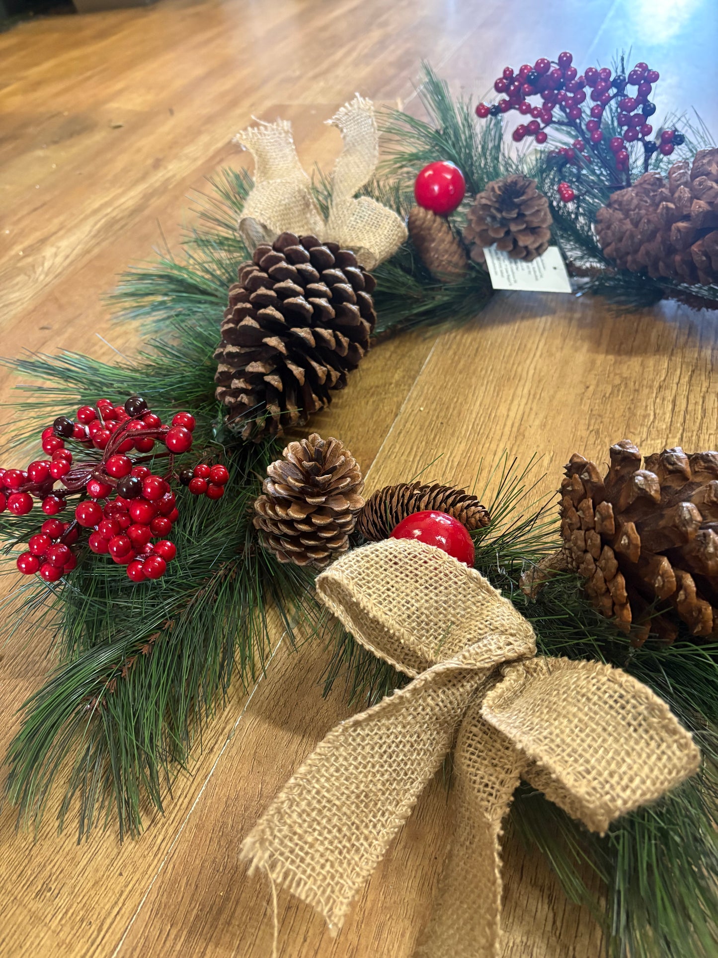 Red berry, cone and bow wreath (55cm from tip to tip)