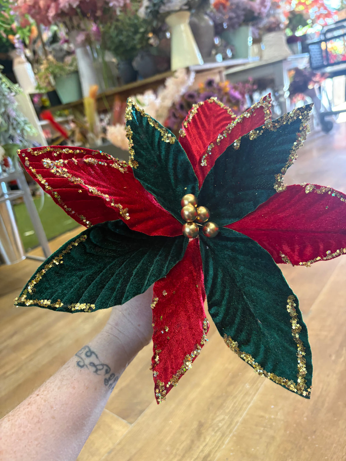 Red and green velvet and gold glittered poinsettia