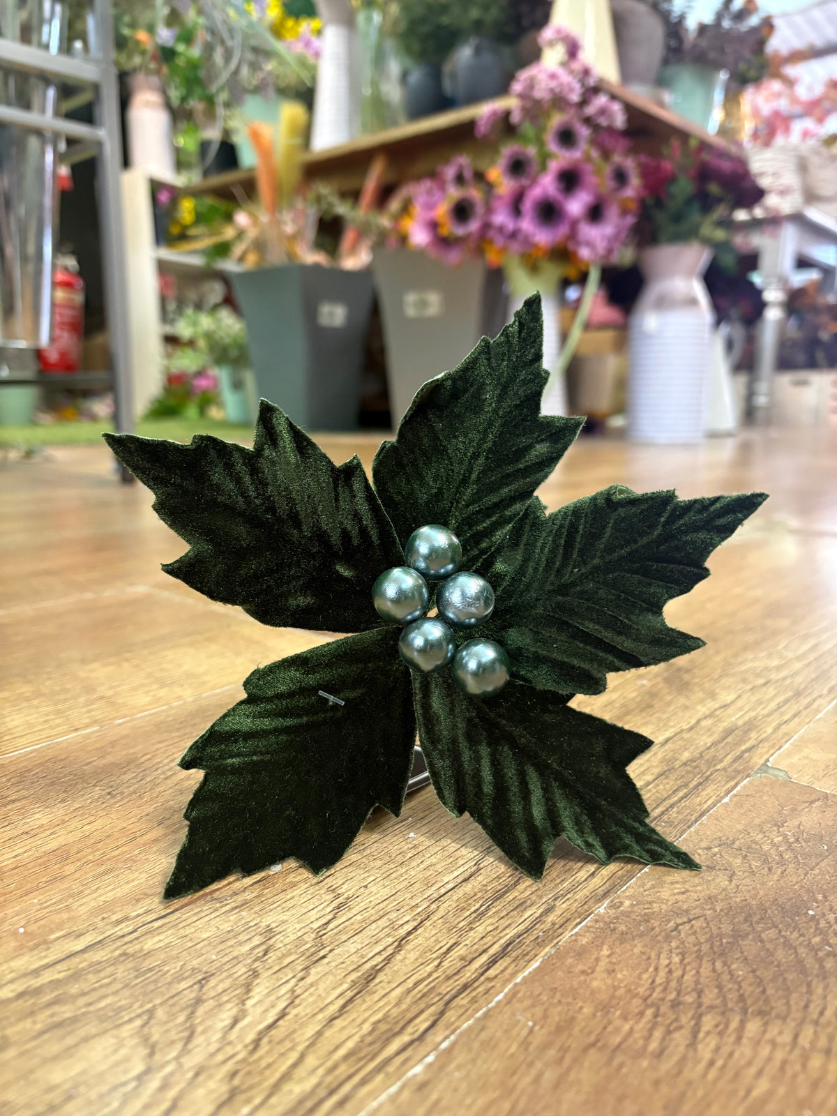 Small green velvet poinsettia pick
