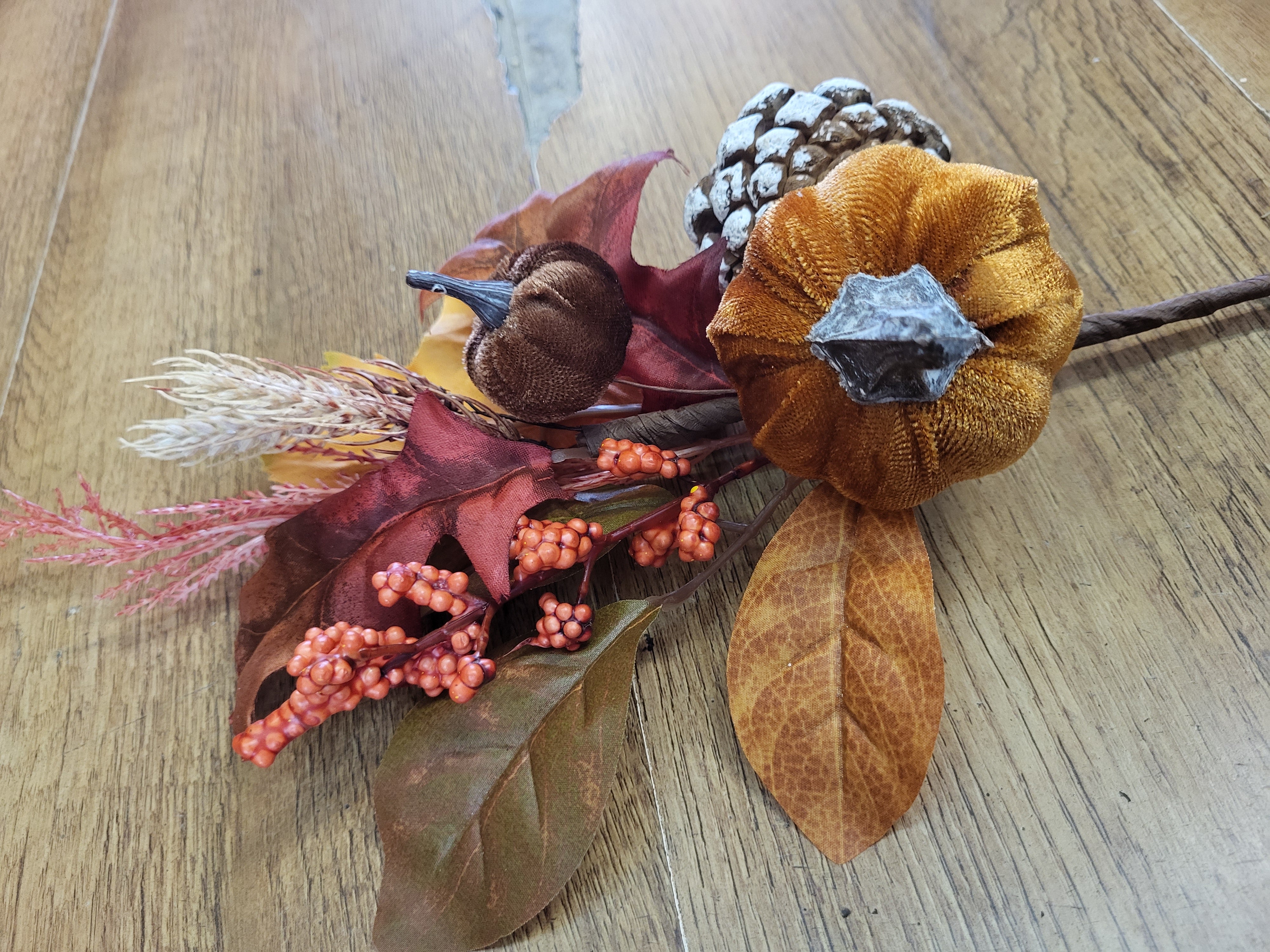 Velvet pumpkin, cones and mixed autumnal foliage branch image 1