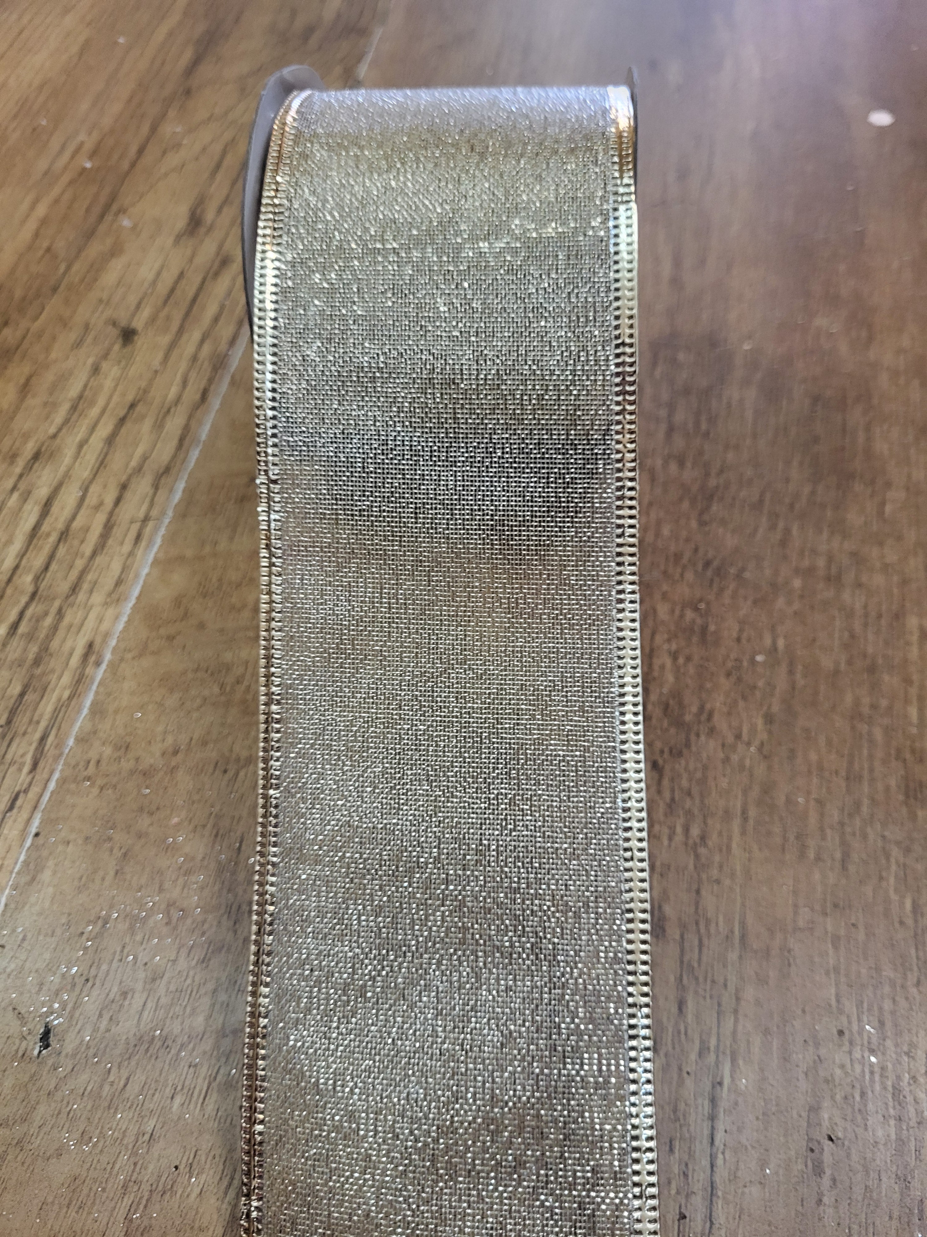 2.7m approx. roll of champagne gold shimmery wired ribbon image 0