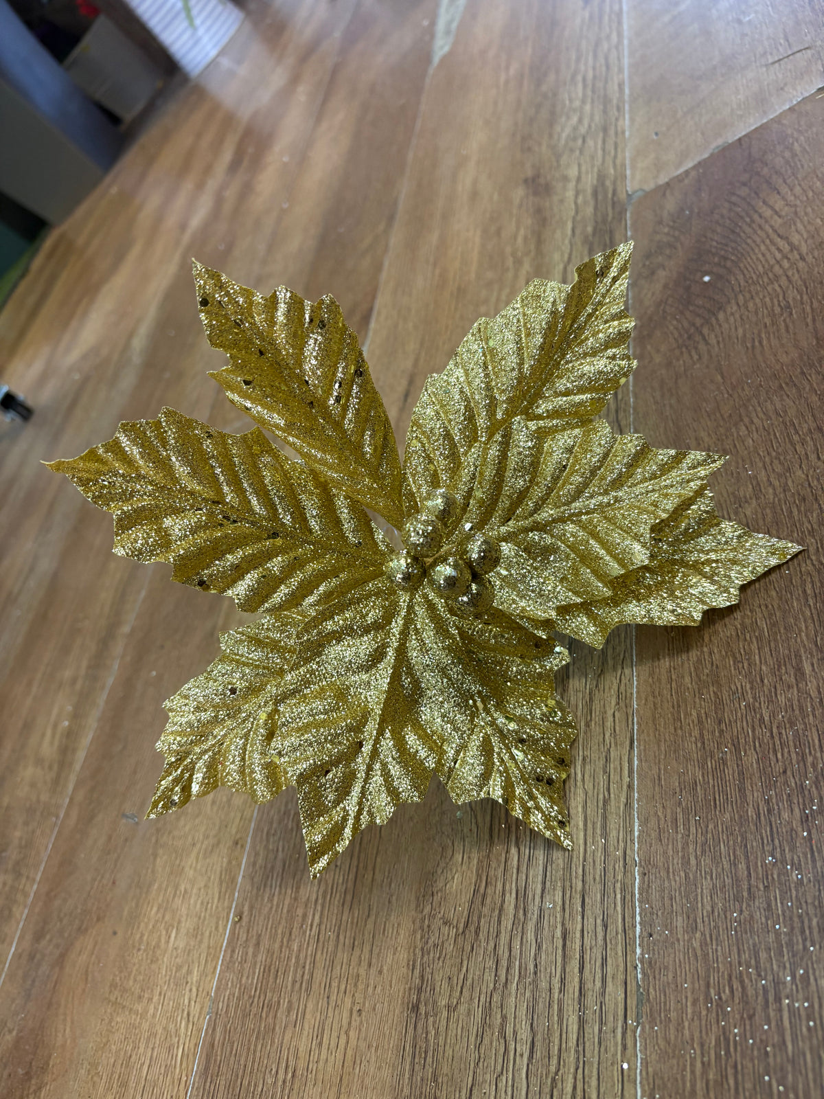 Short gold glittered poinsettia