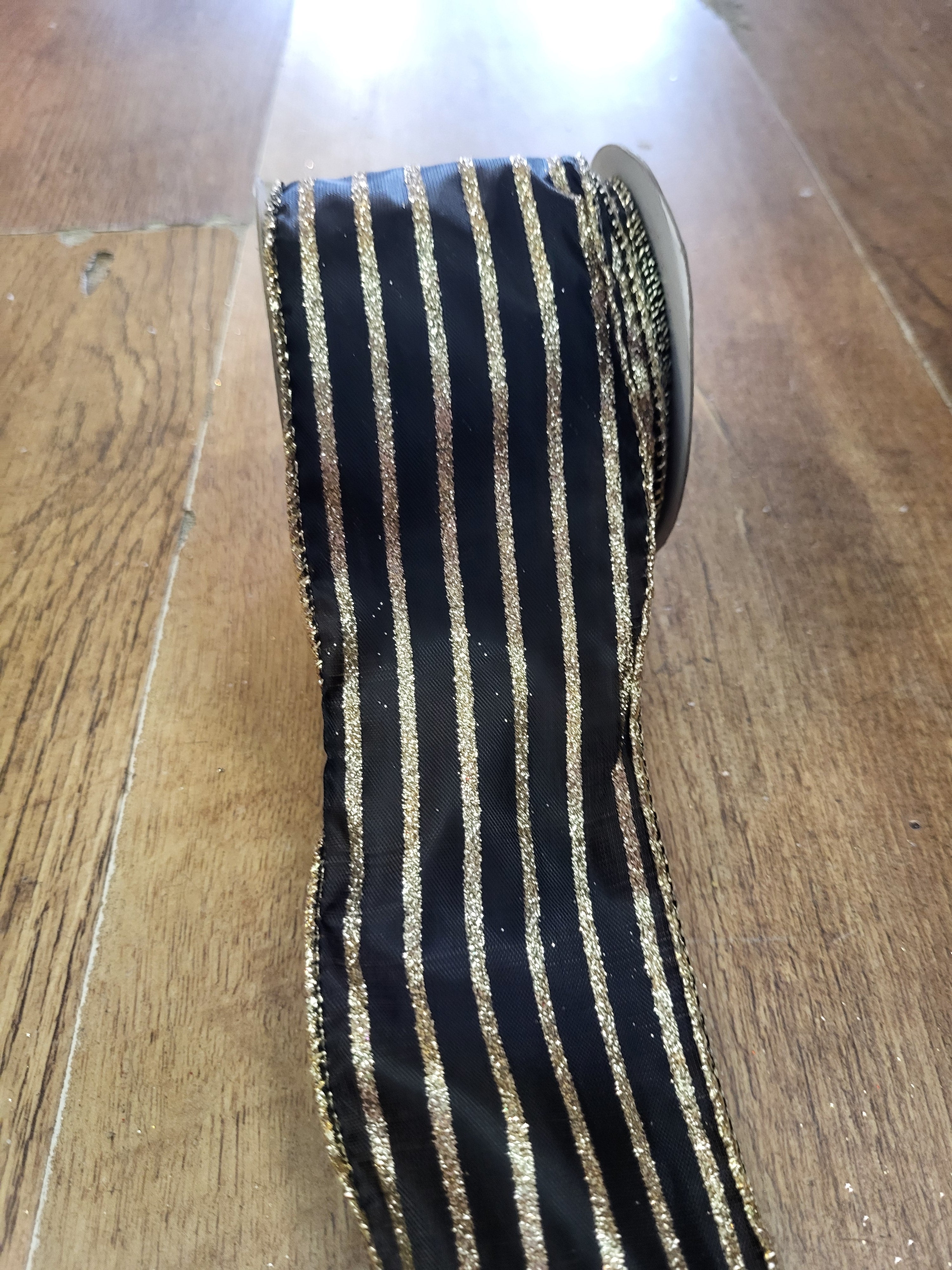2.7m approx. roll of black with gold glitter striped wired ribbon image 0