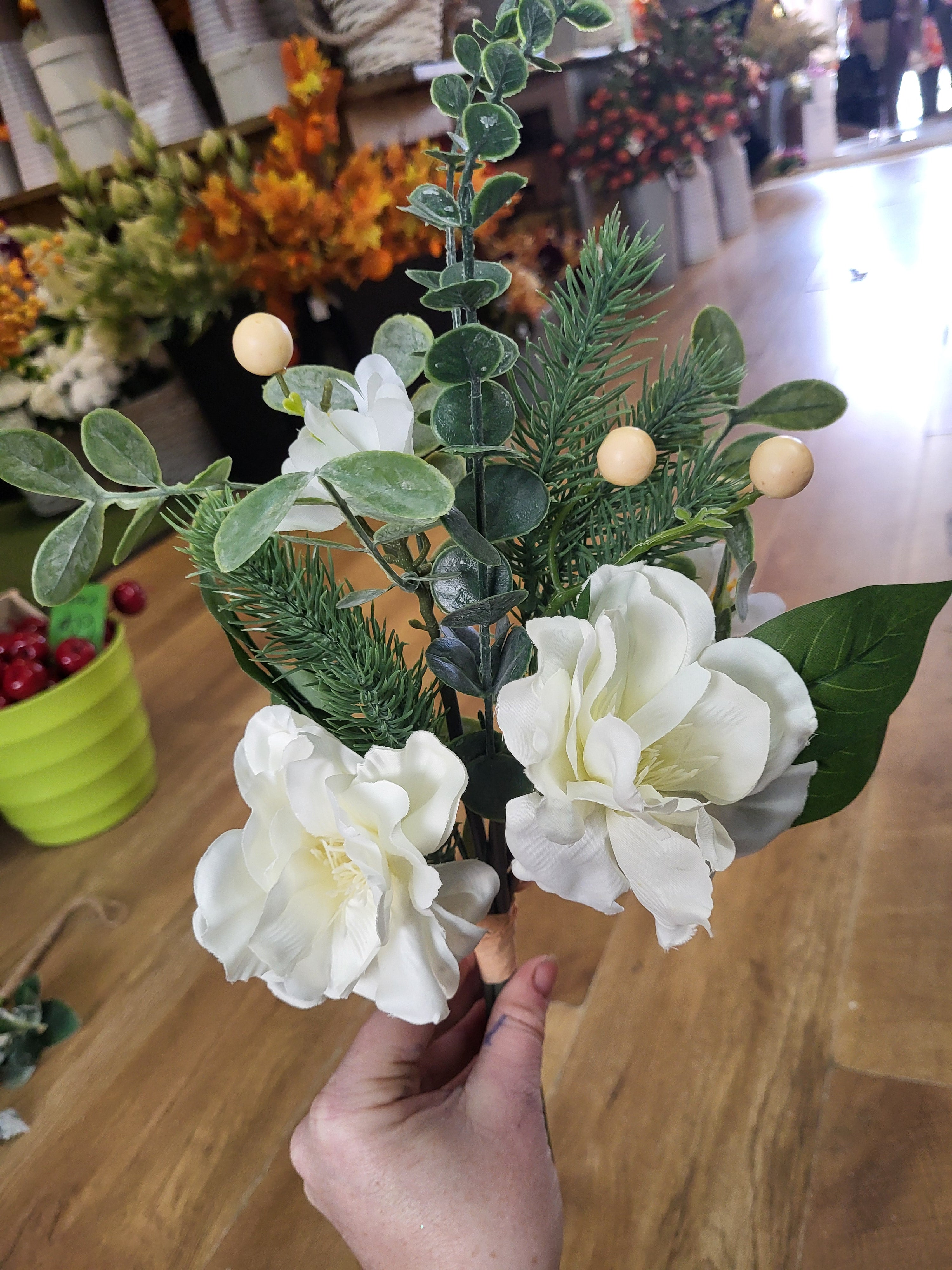 Hand tied winter foliage bundle with ivory flowers and cream berries image 4