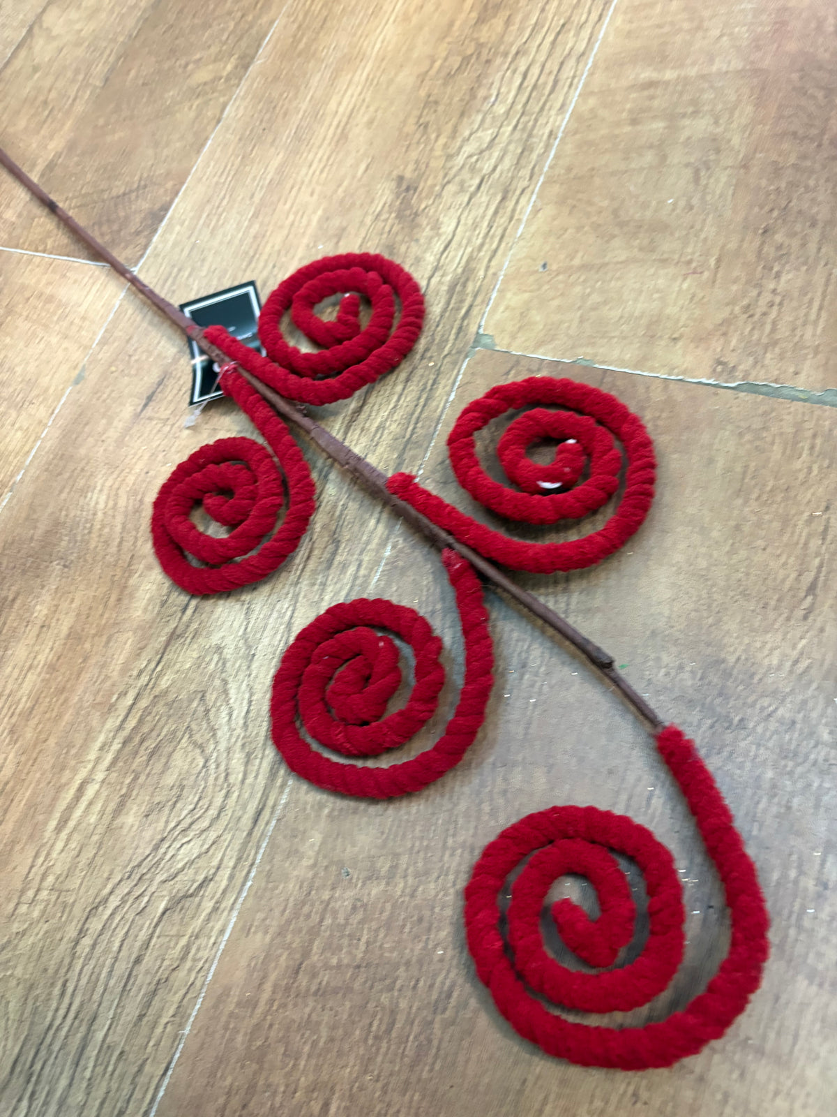 Long stem fluffy red swirly stem