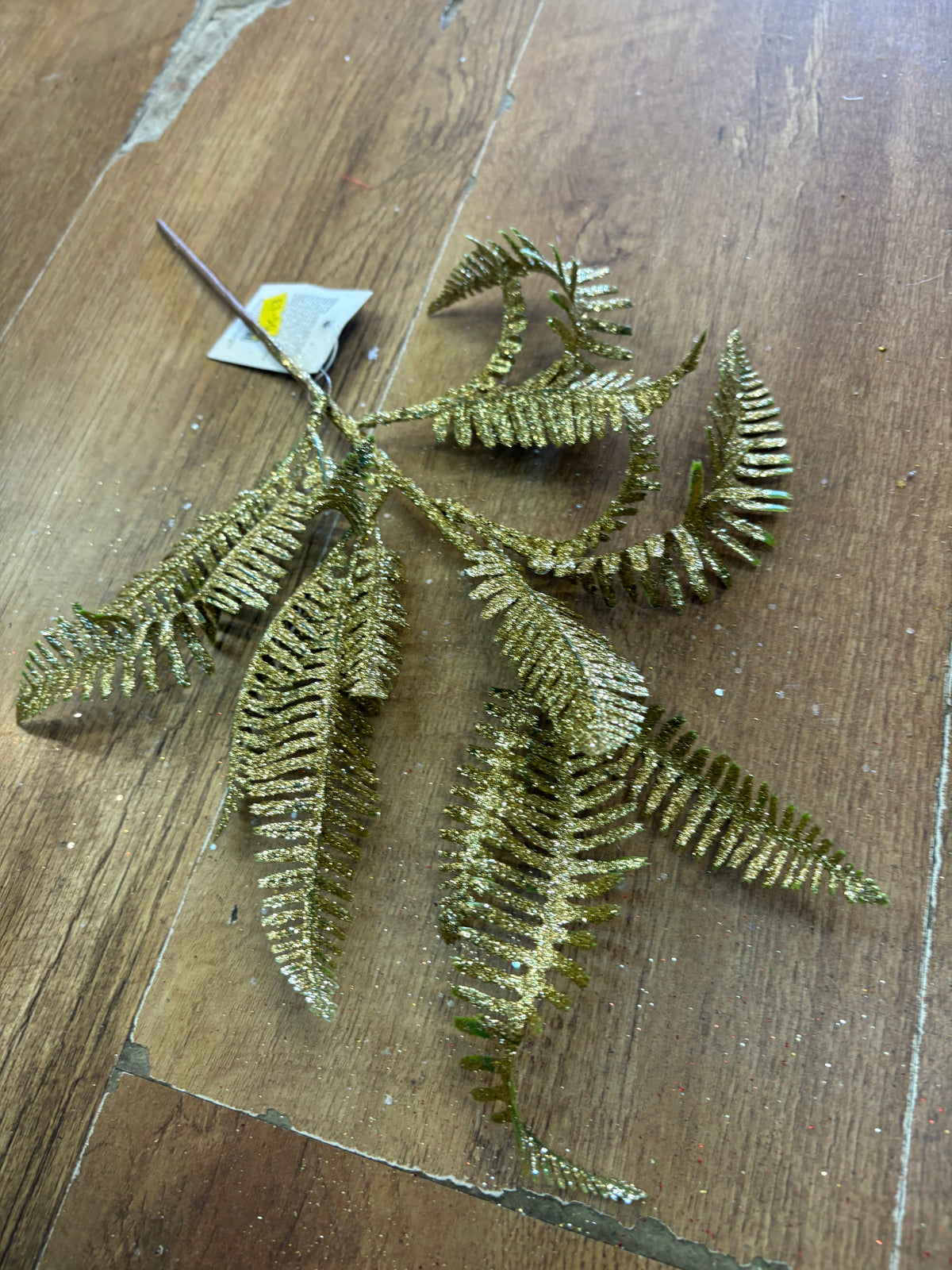 Gold glittered fern stem