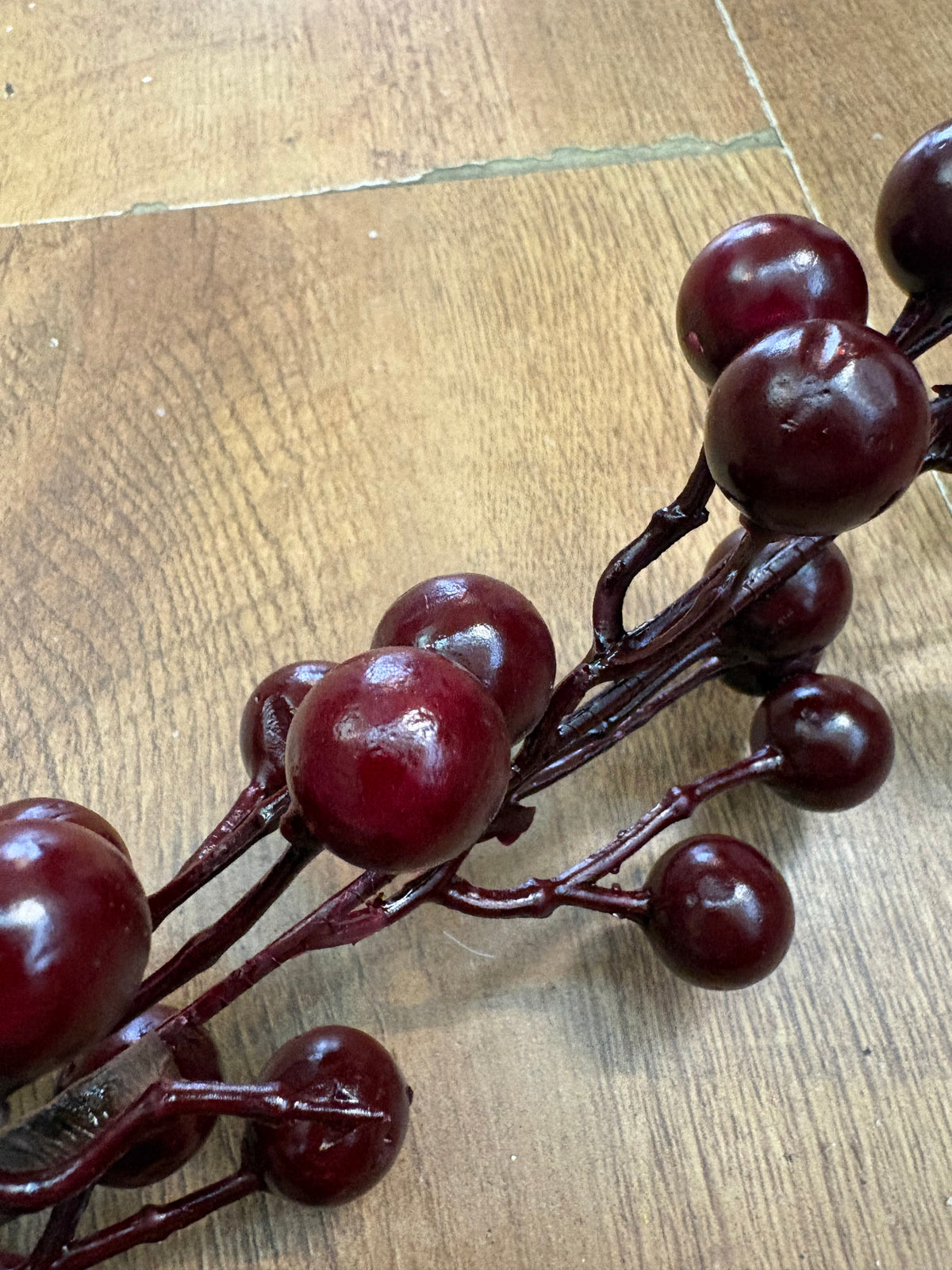 Long stem deep burgundy berry spray