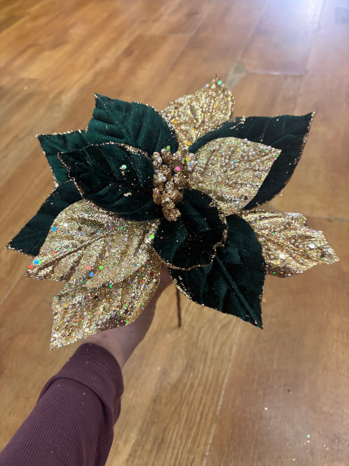 Short stem green velvet and gold glittered poinsettia with pearls