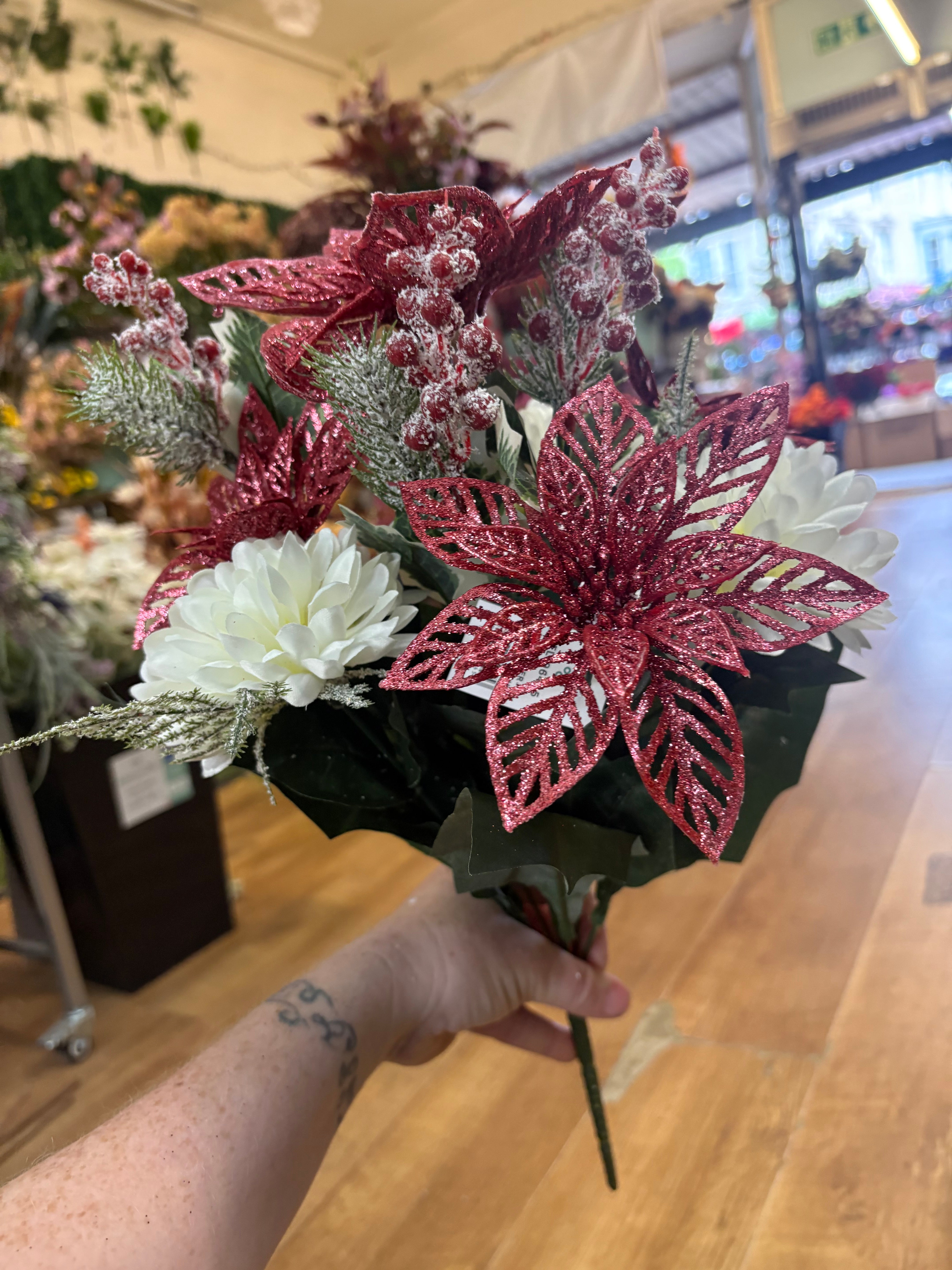 Pink glittered poinsettia and cream chrysanthemum bouquet