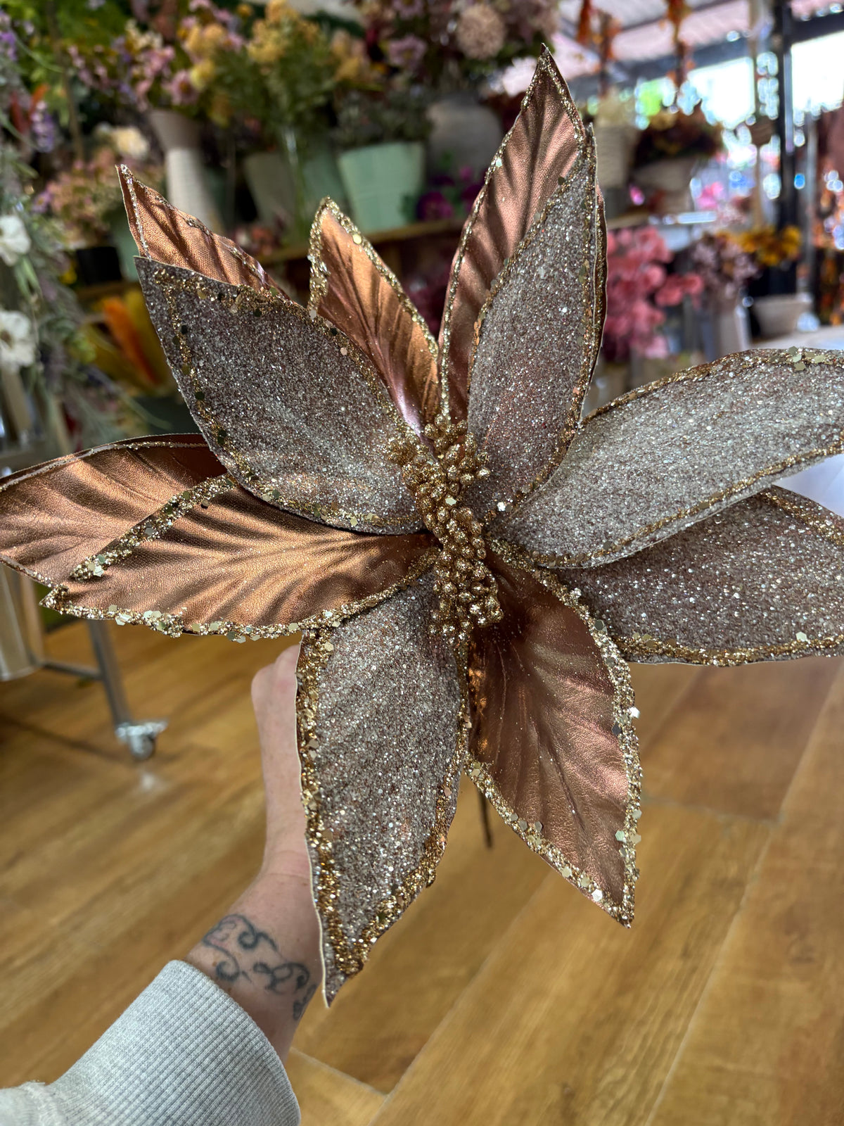 Large rose gold metallic and glittered single long stem poinsettia