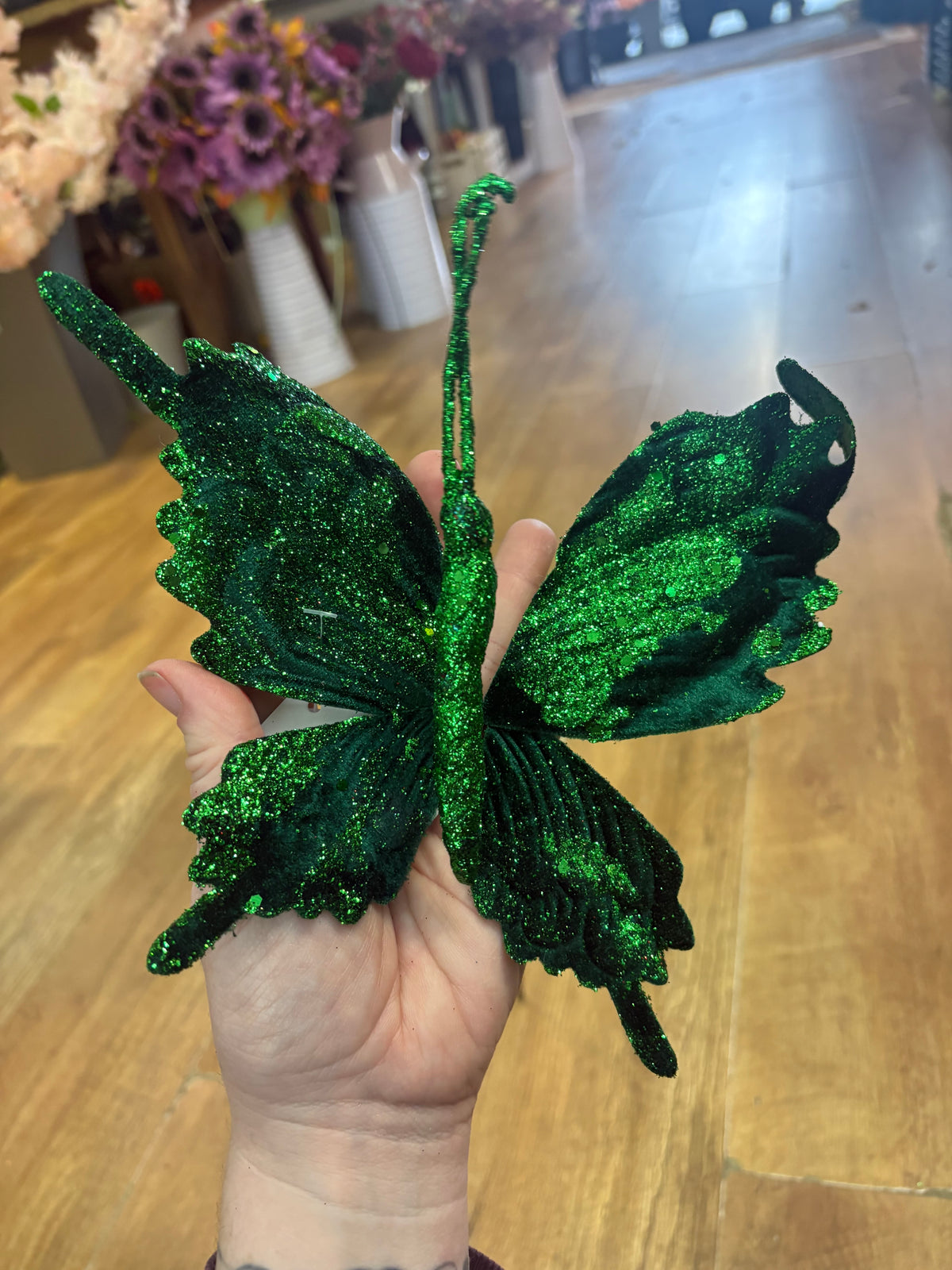 Long stem green velvet and glitter butterfly