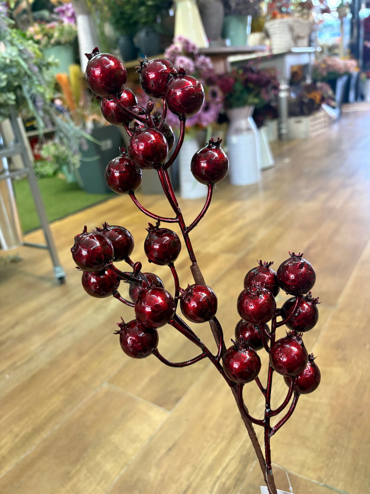 Long stem metallic burgundy rose hip spray