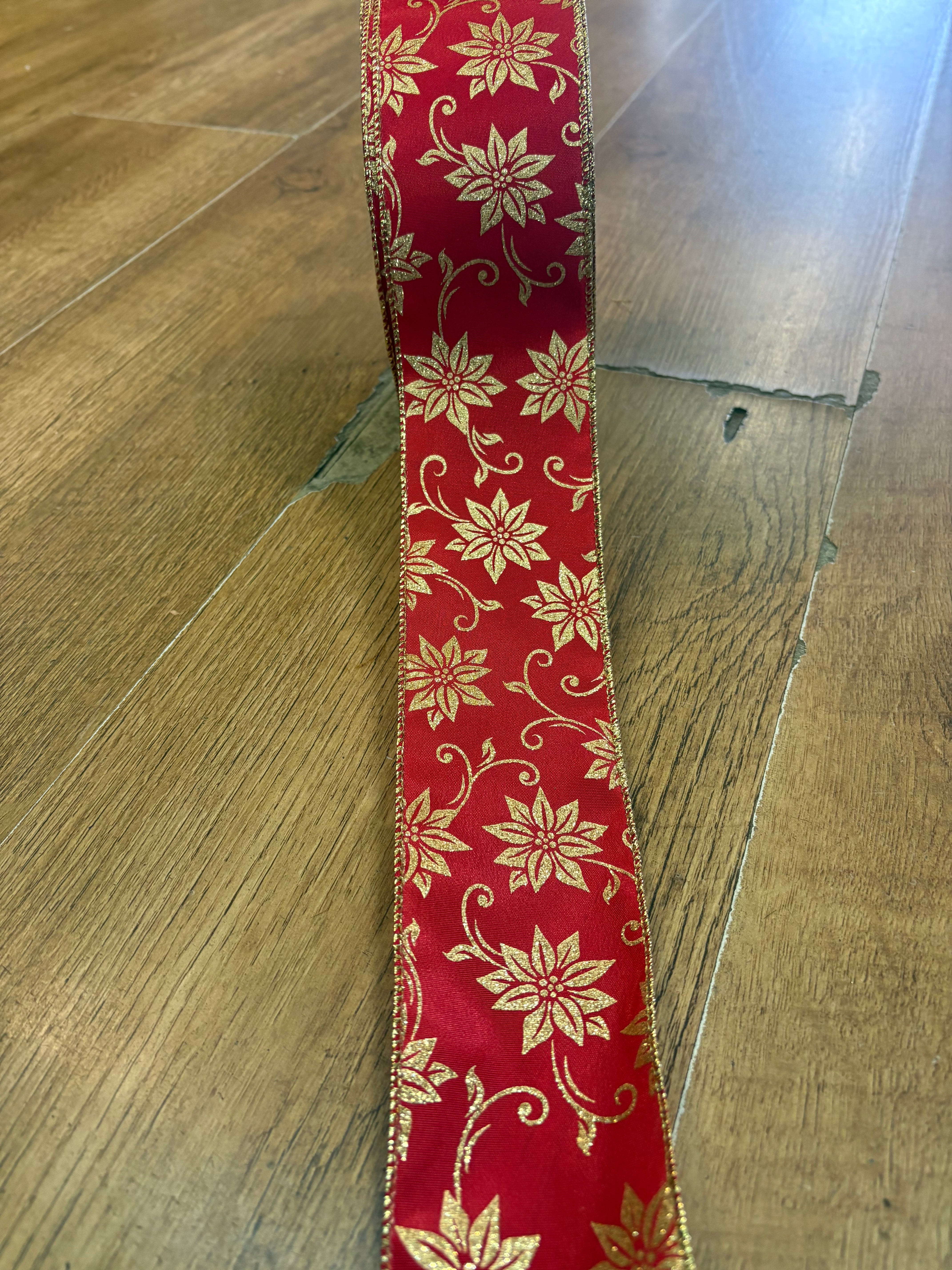 2.5 inch wide red and gold glittered poinsettia wired ribbon - 10 metres