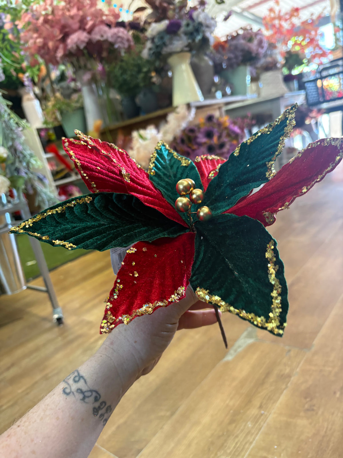 Red and green velvet and gold glittered poinsettia