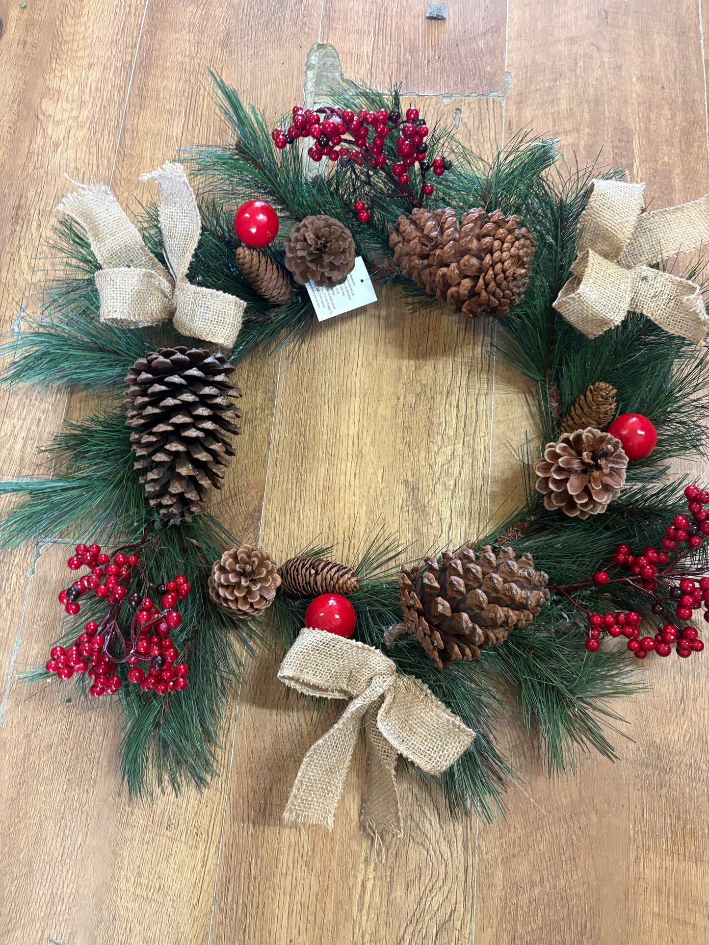 Red berry, cone and bow wreath (55cm from tip to tip)