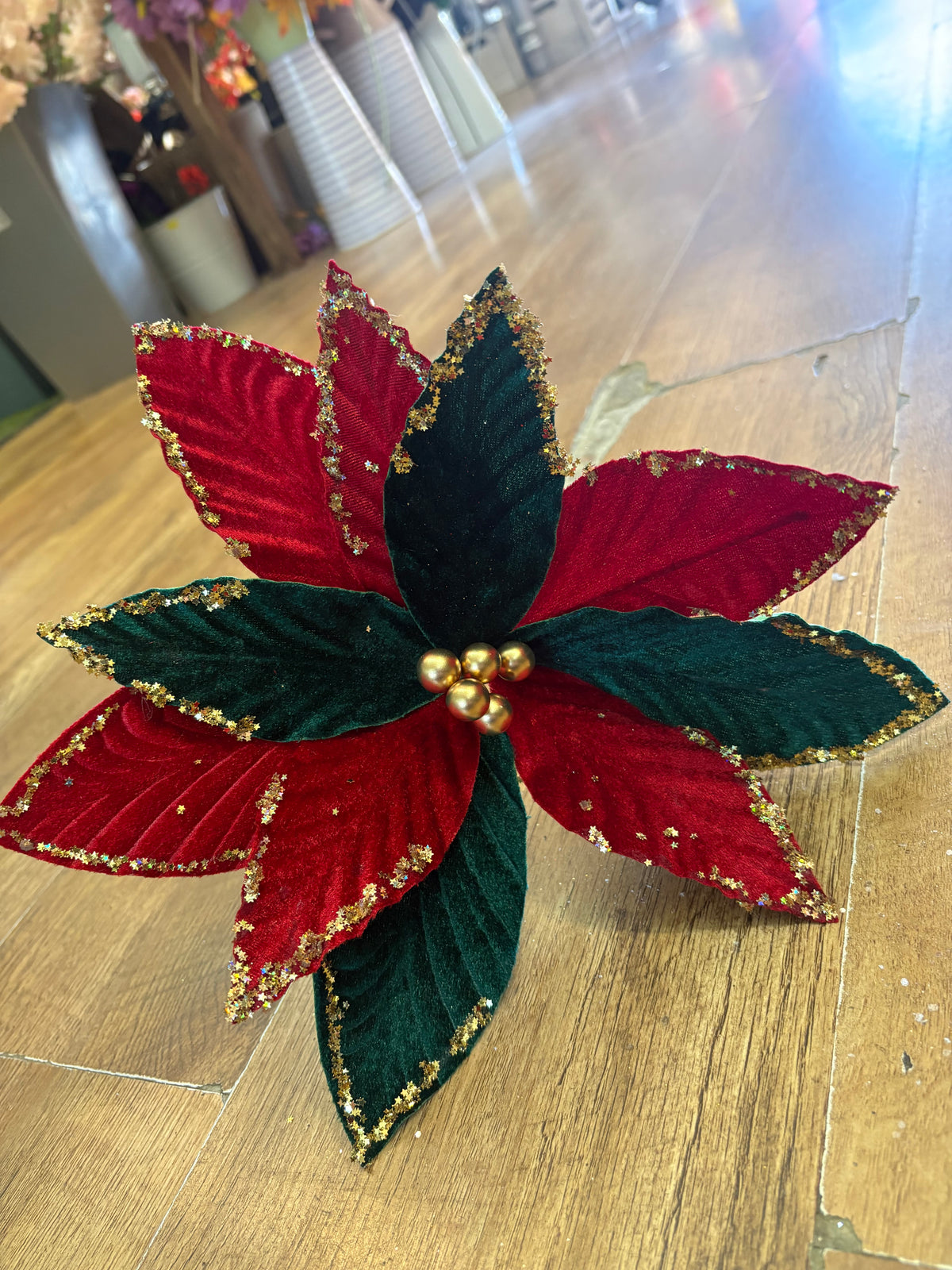 Red and green velvet and gold glittered poinsettia