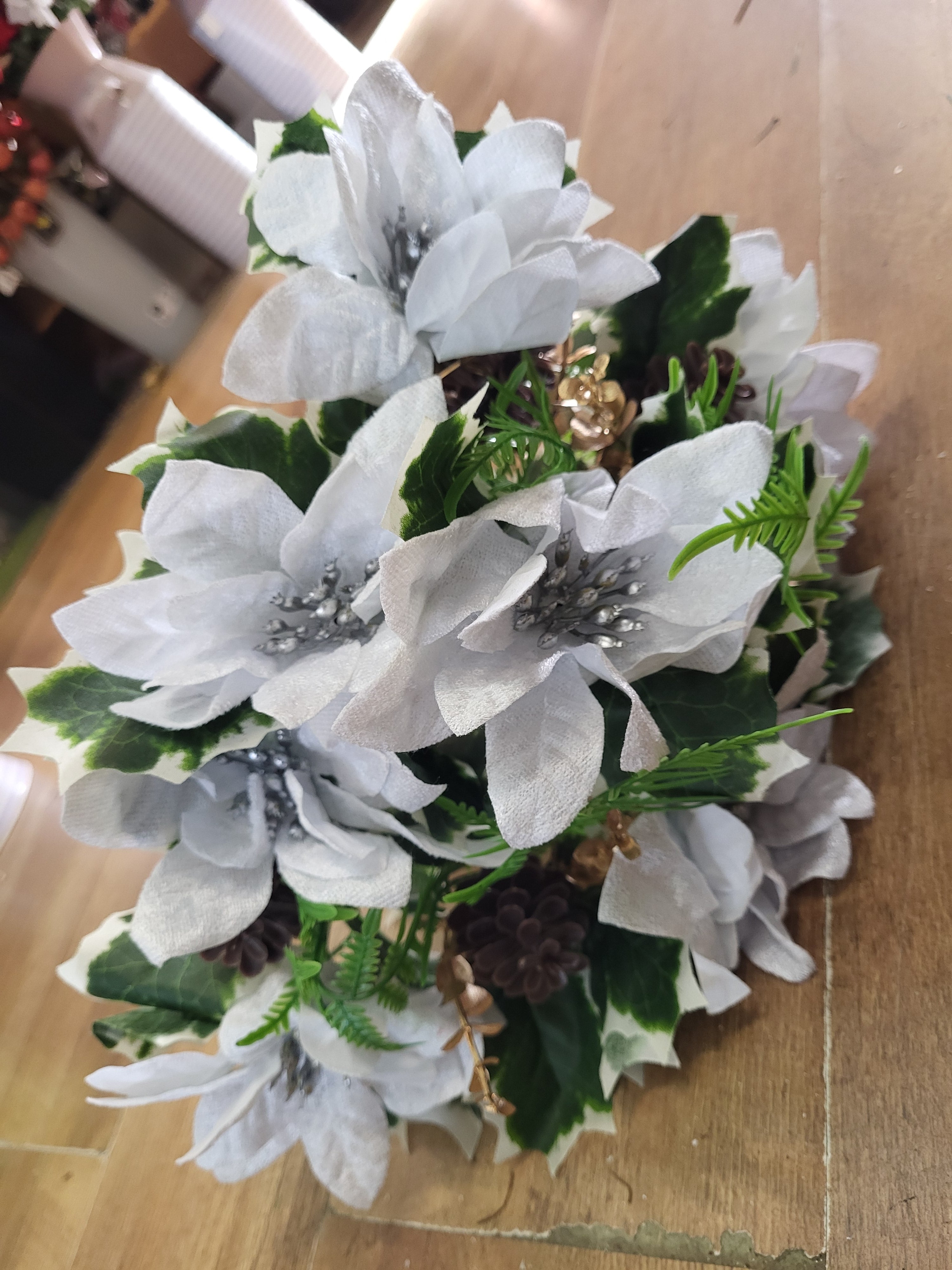 Large white velvet poinsettia and cone bouquet  image 0