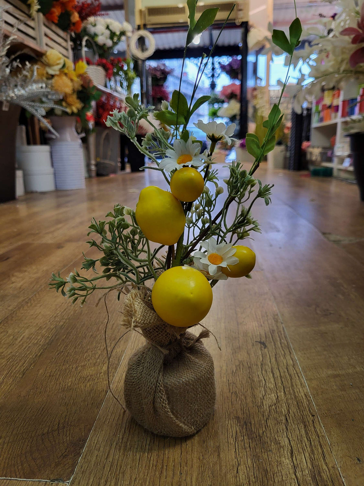 35cm lemons and daisies with foliage in burlap spring arrangement image 1