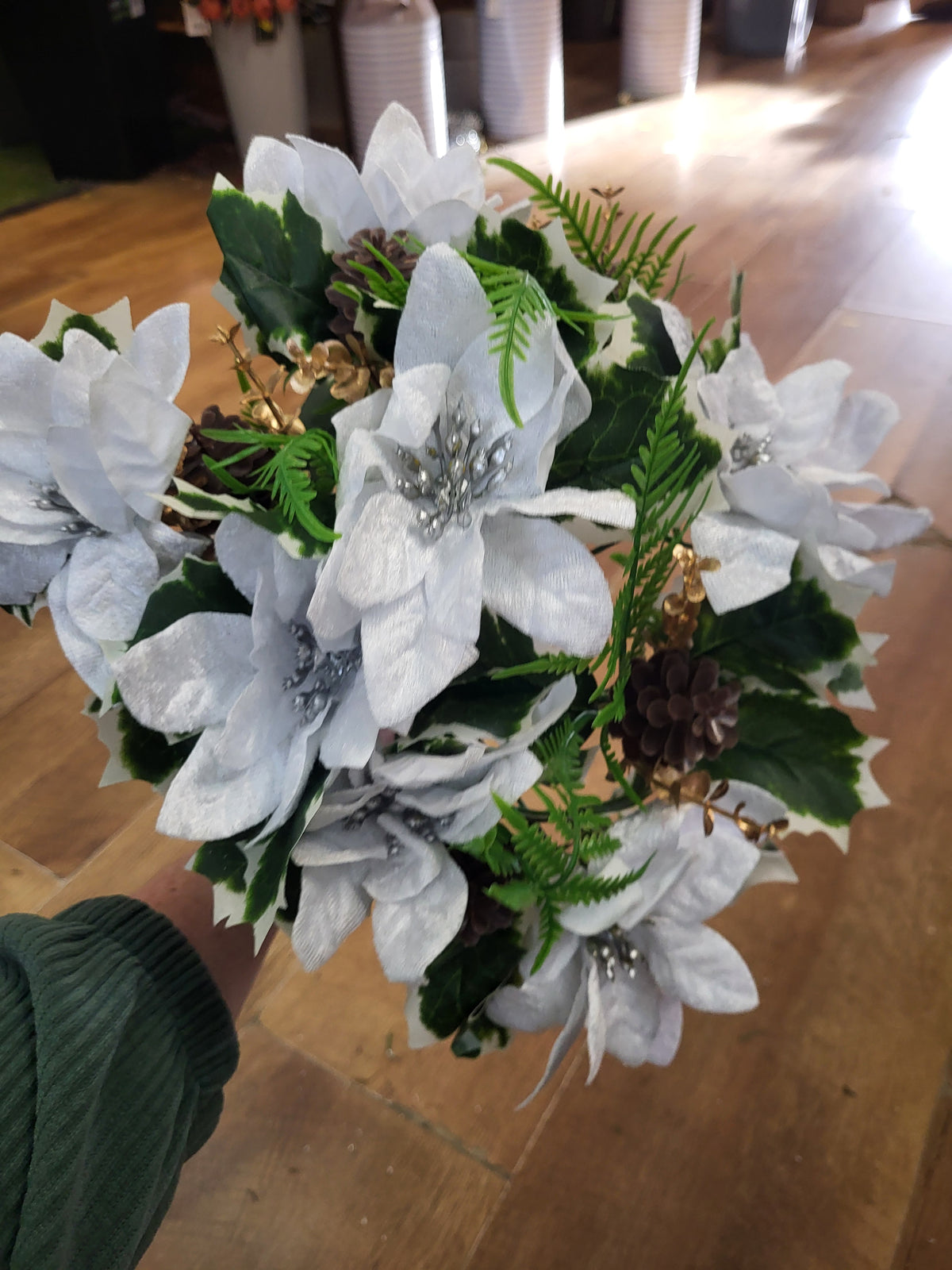 Large white velvet poinsettia and cone bouquet  image 3
