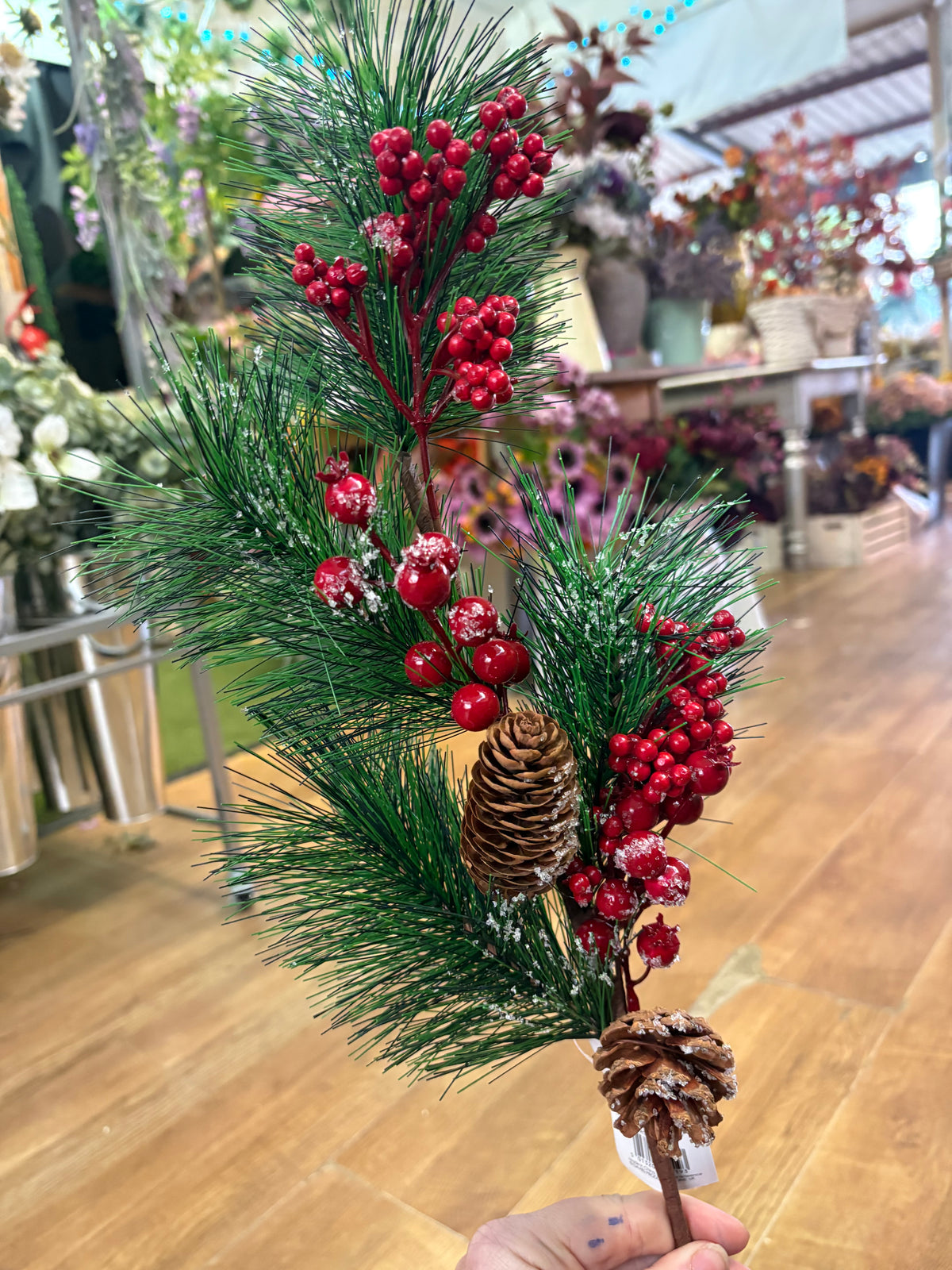 Long stem frosted foliage wi5 cones and mixed berries