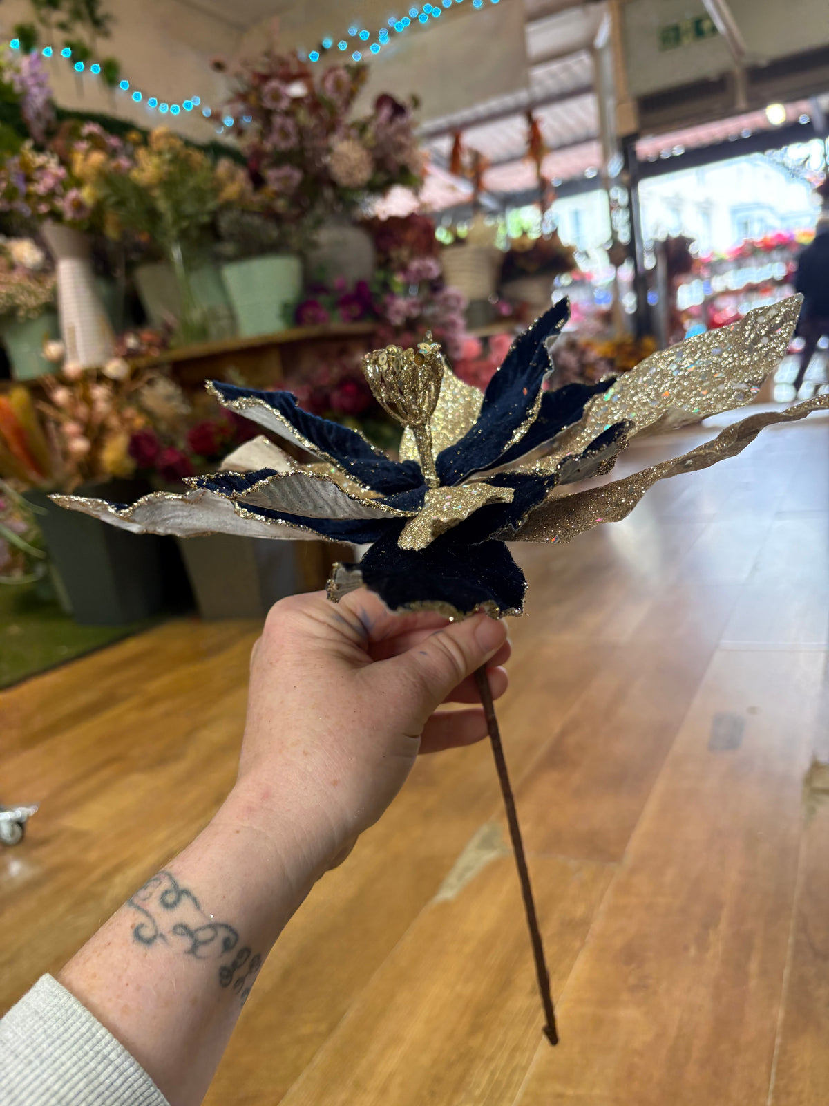 Navy velvet and champagne gold glittered single poinsettia