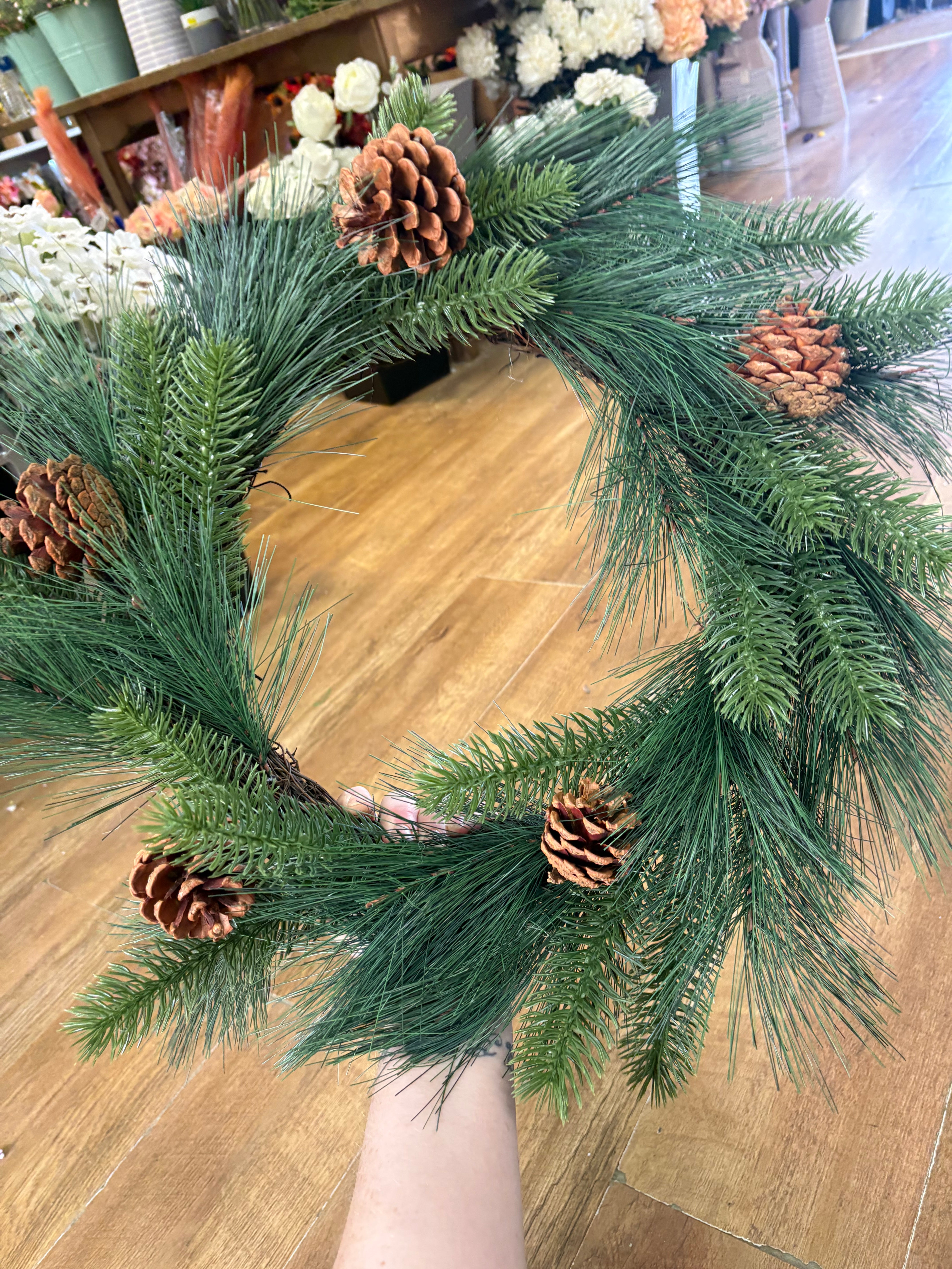 55cm mixed pine and spruce with cones wreath on grapevine base
