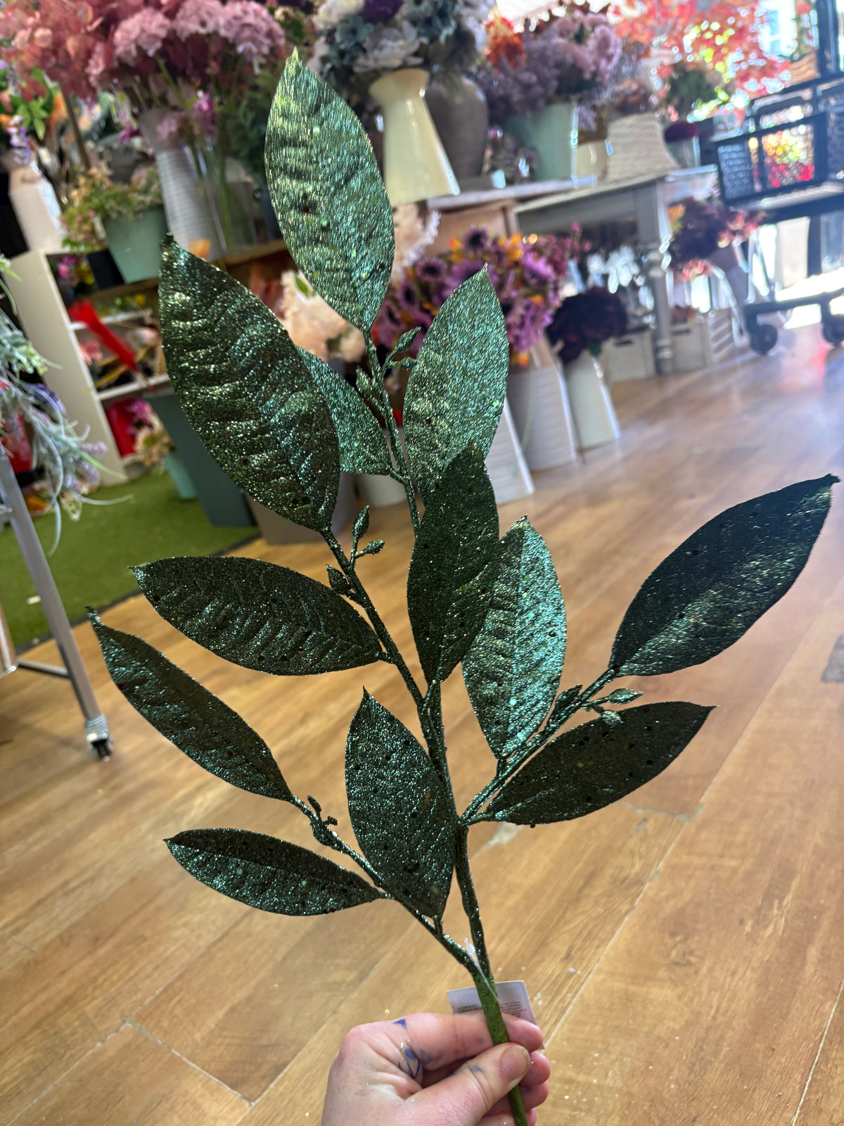 Larger green glittered foliage stem