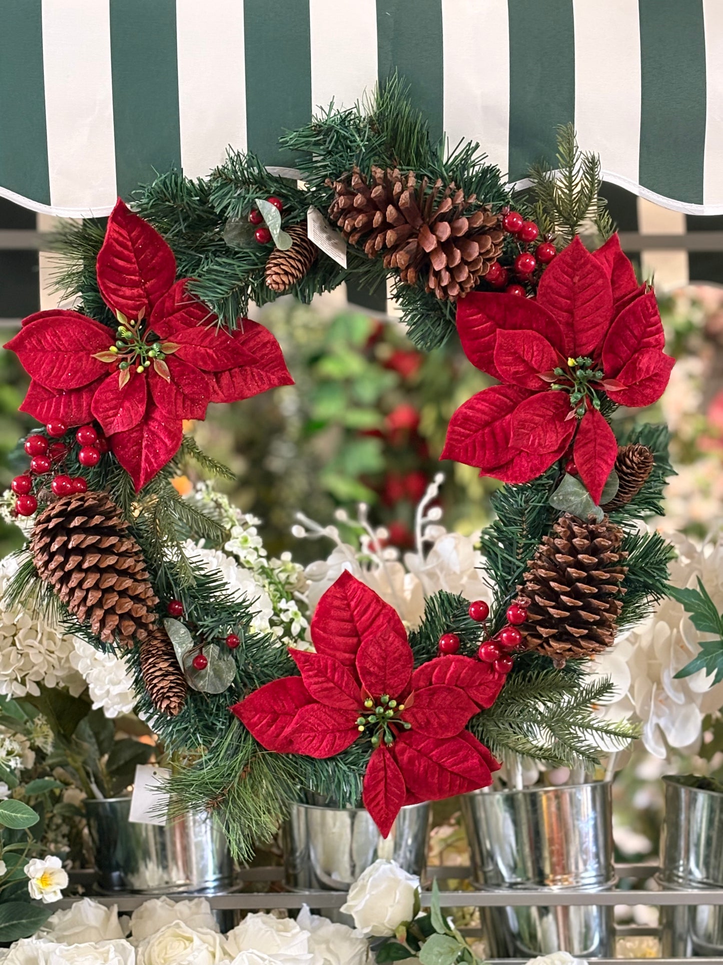 Poinsettia and red berry wreath (55cm from tip to tip)