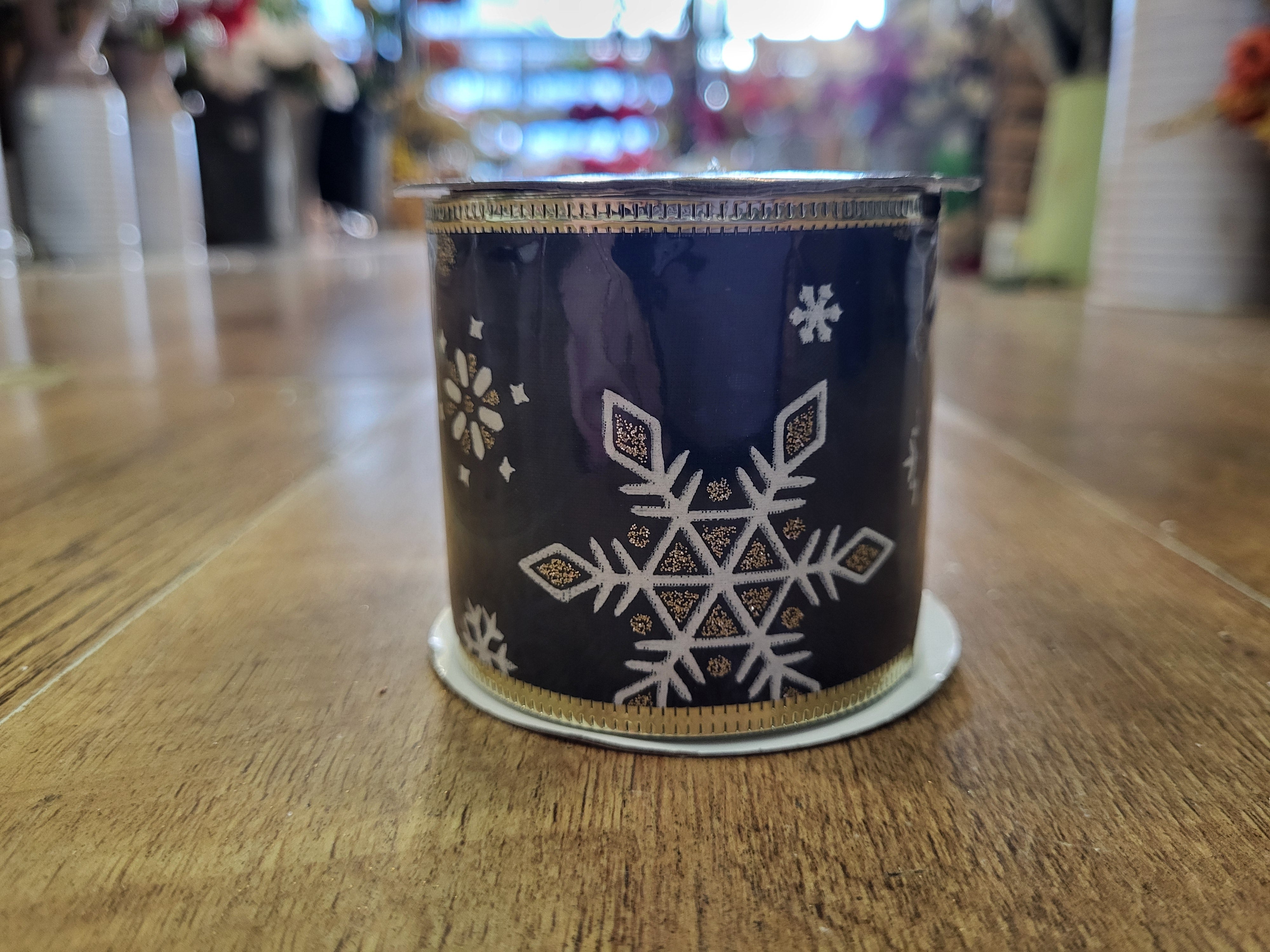 2.7m approx. roll of navy/champagne gold snowflake wired ribbon image 1