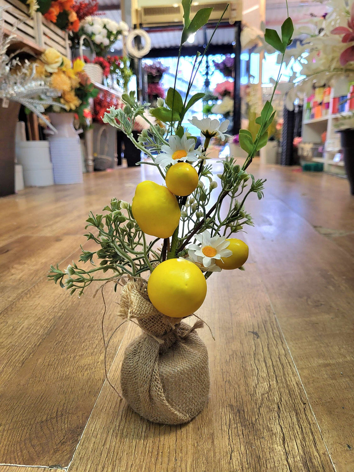 35cm lemons and daisies with foliage in burlap spring arrangement image 0