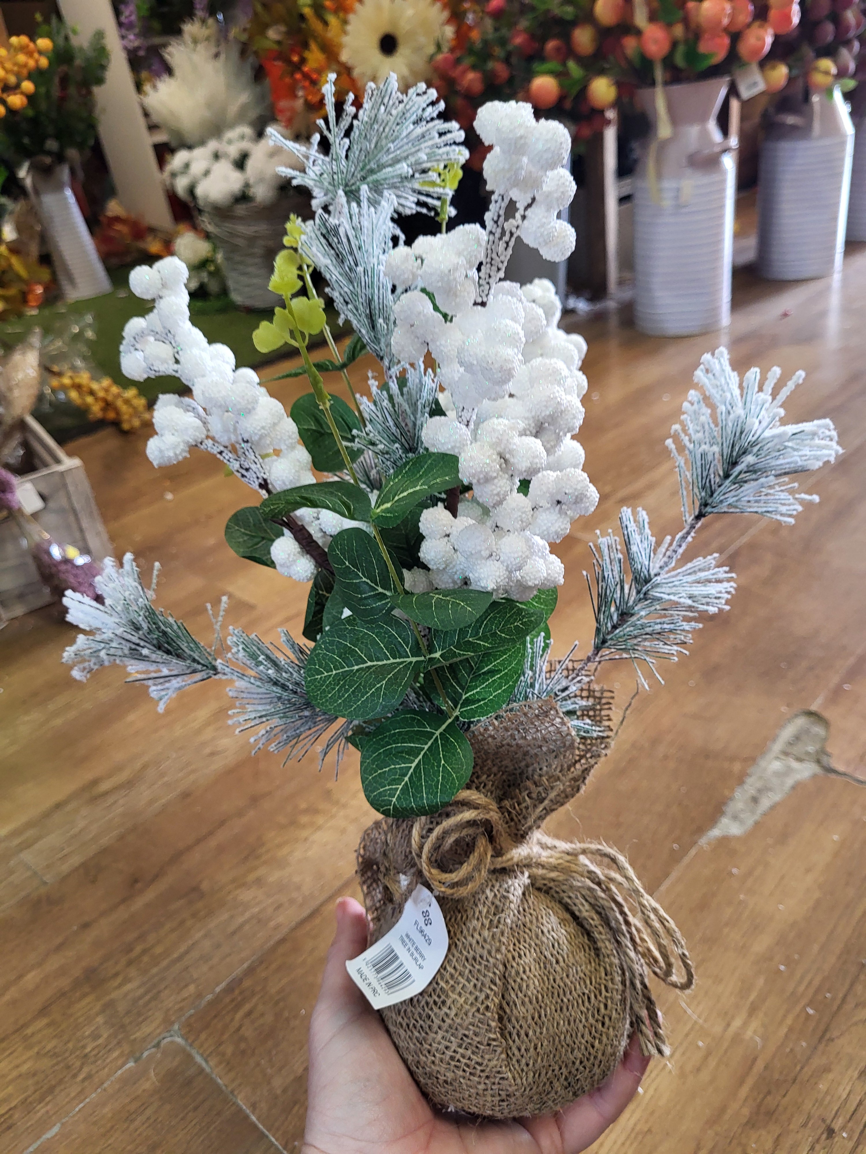 Frosted white berries and foliage wrapped in burlap - table centre piece image 1