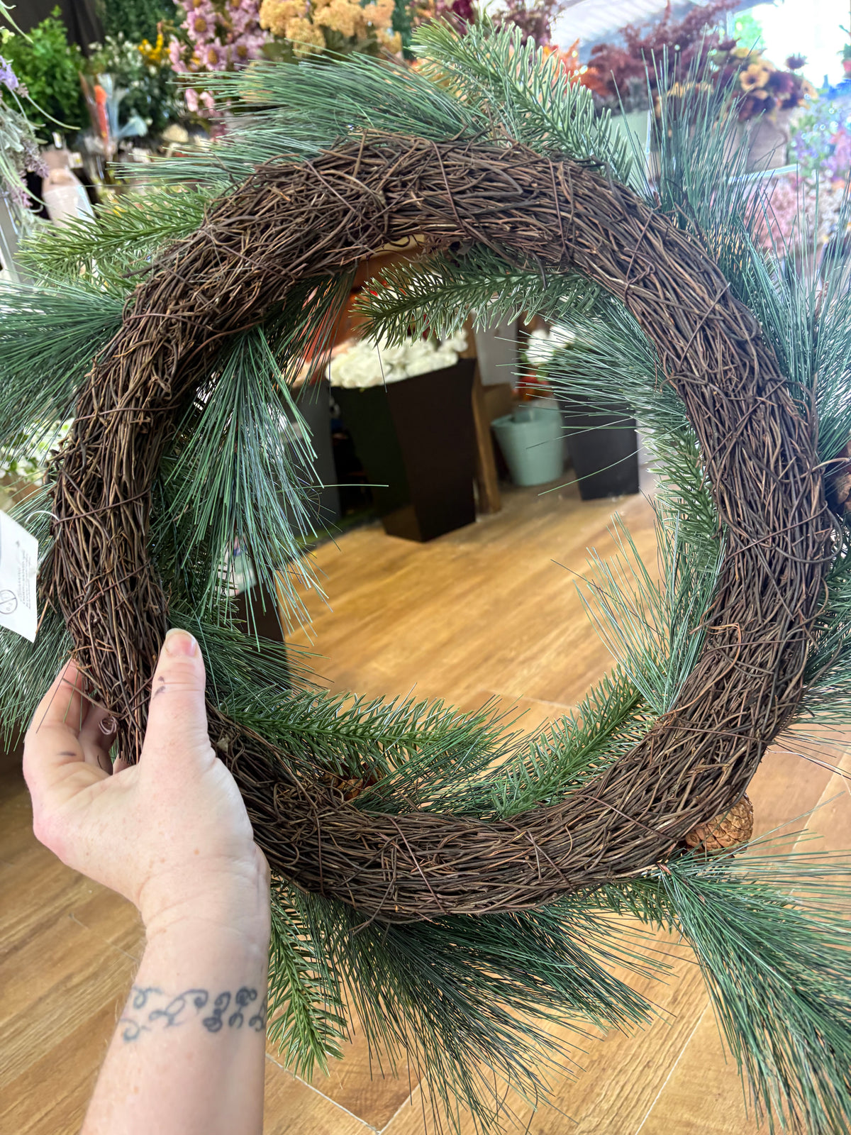 55cm mixed pine and spruce with cones wreath on grapevine base
