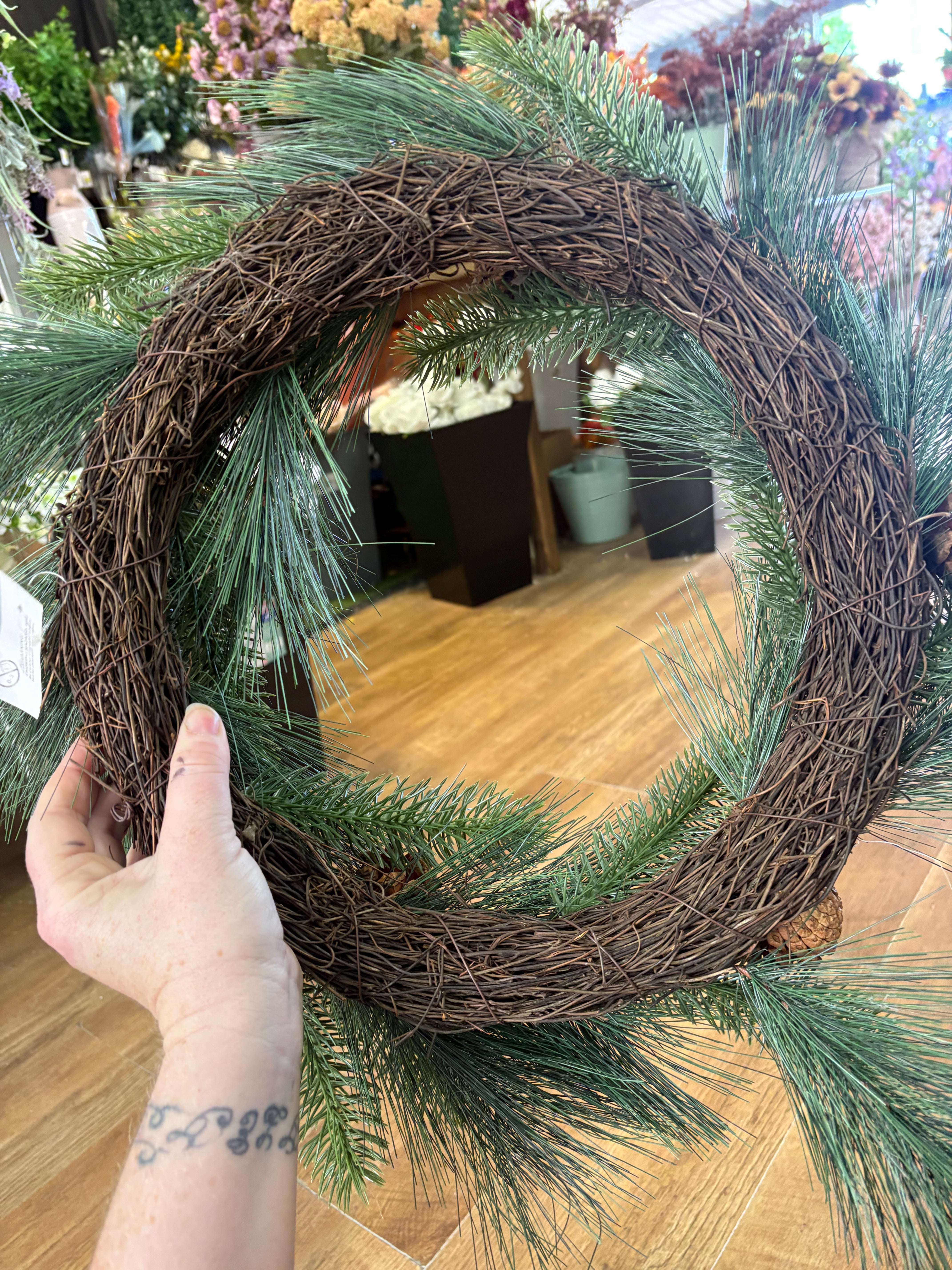 55cm mixed pine and spruce with cones wreath on grapevine base