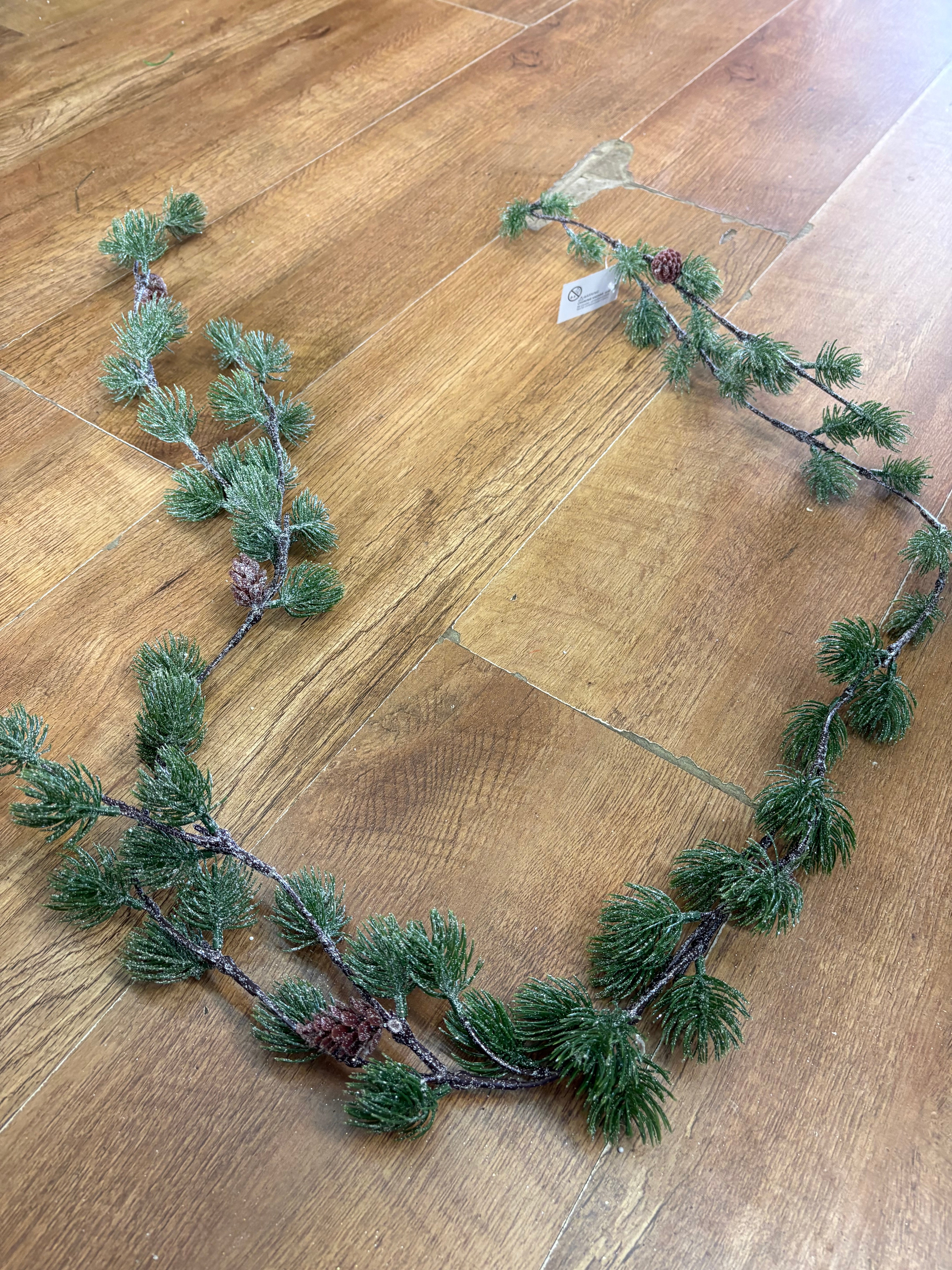 Glittered thistle greenery and miniature cone garland