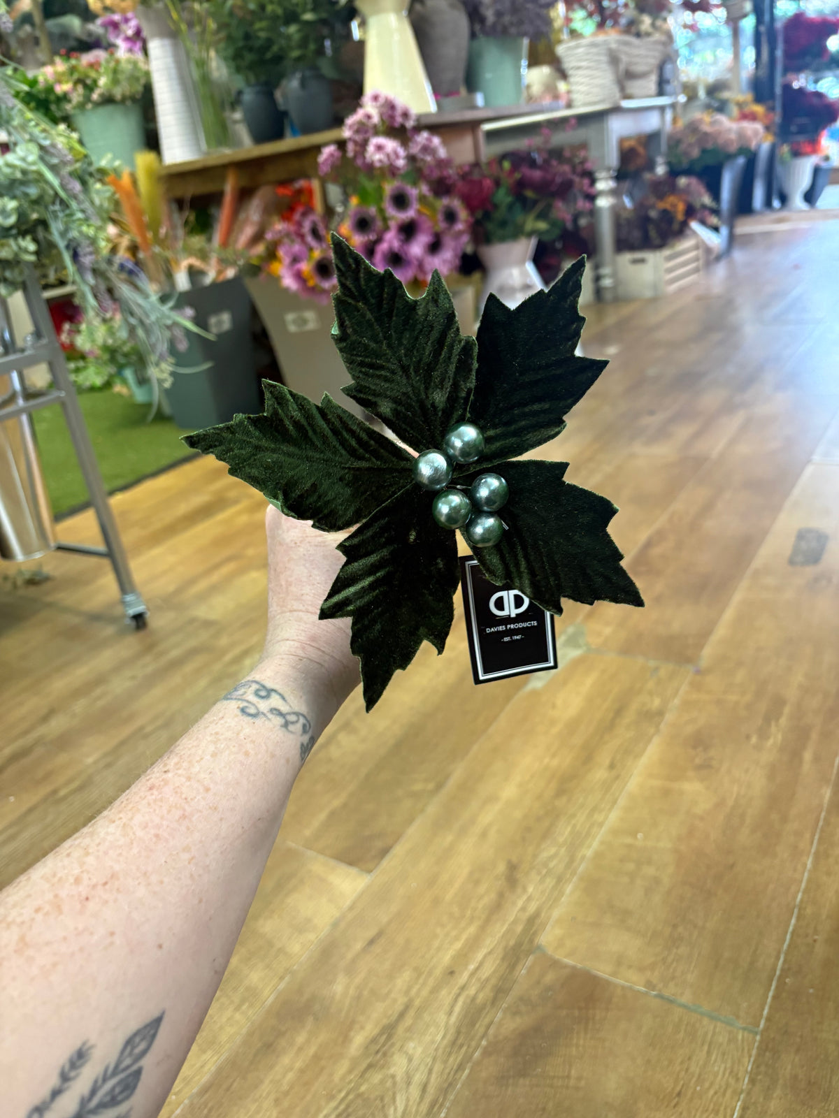Small green velvet poinsettia pick