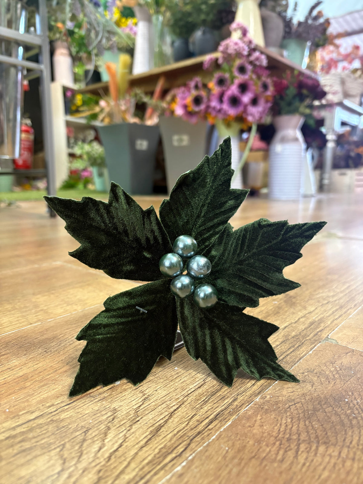 Small green velvet poinsettia pick