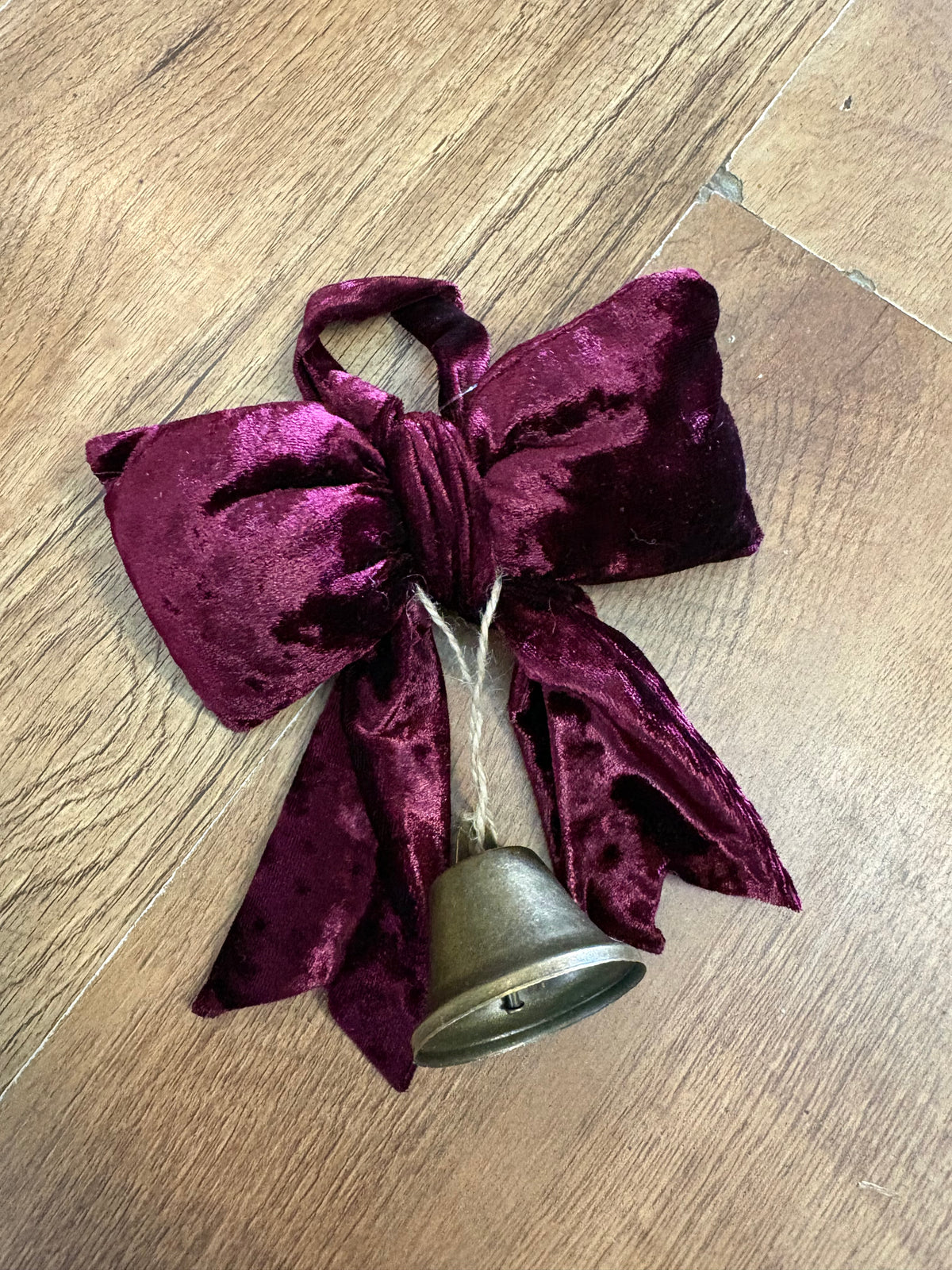 Small hanging burgundy velvet bow and Christmas bell