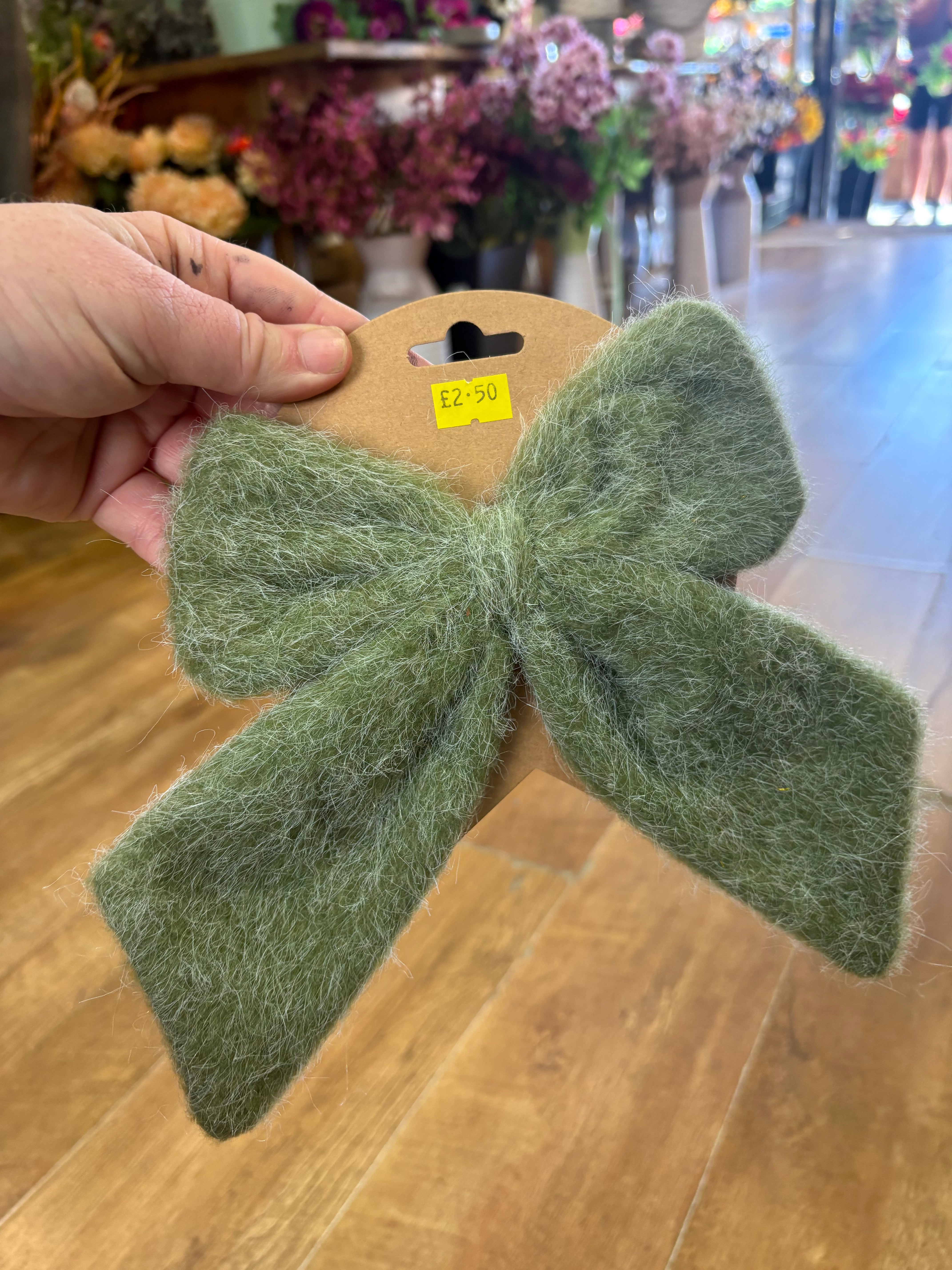Small green fleece Christmas bow